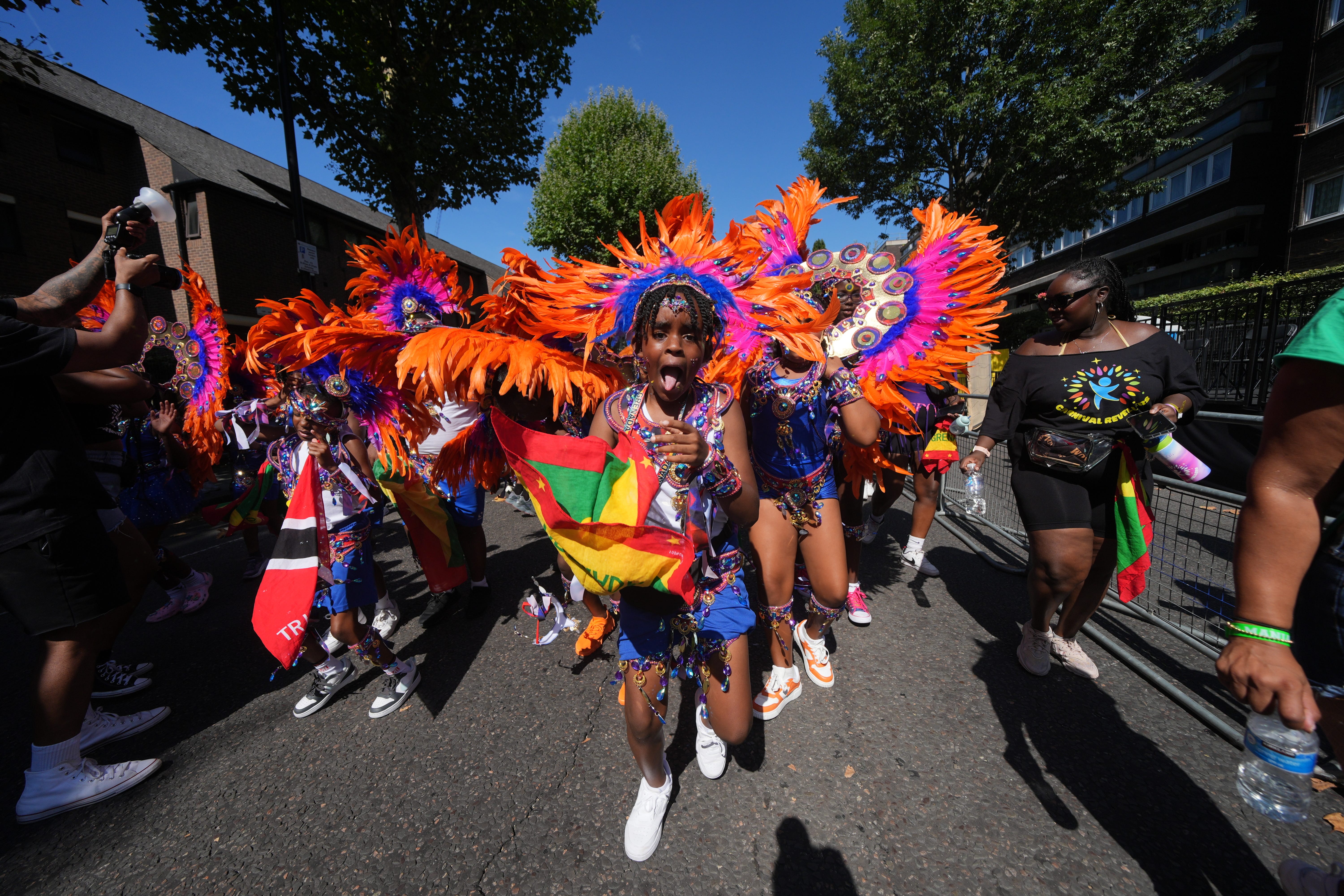 People taking part in the Children’s Day Parade, part of Notting Hill Carnival (Yui Mok/PA)