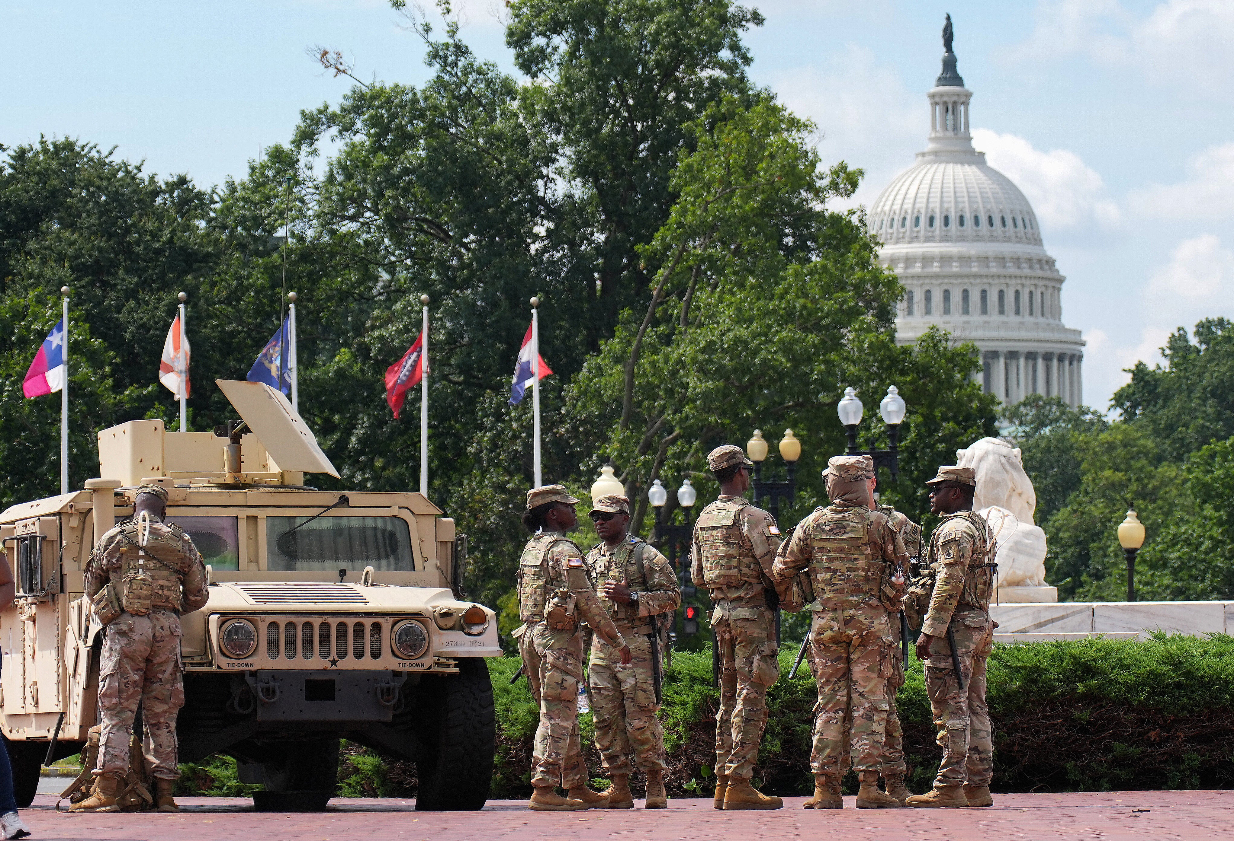 Members of the National Guard stand by at Union Station in Washington, D.C., as part of President Trump's attempt to seize control of policing in the nation's capital