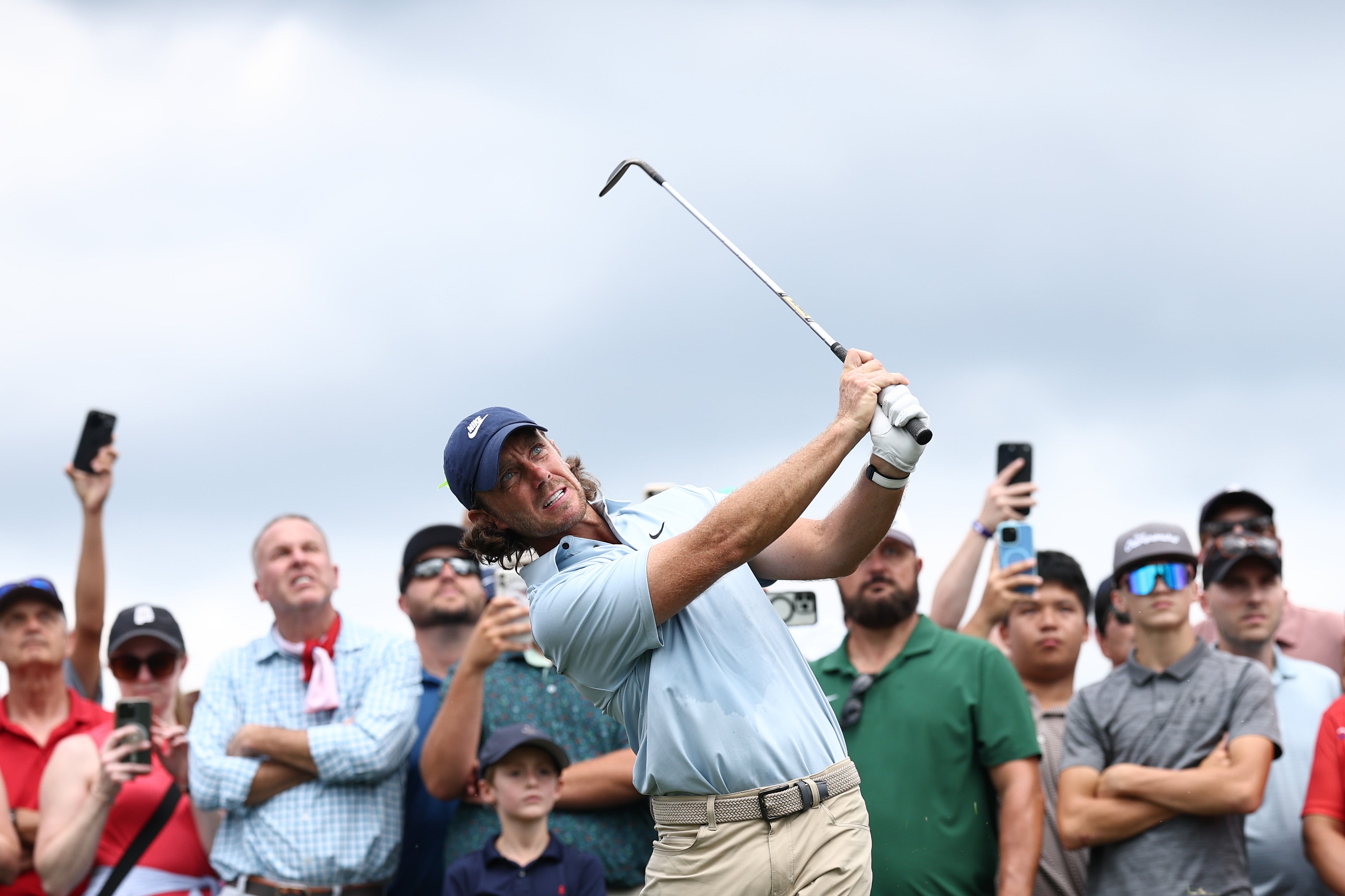 Tommy Fleetwood of England plays a shot on the fifth hole