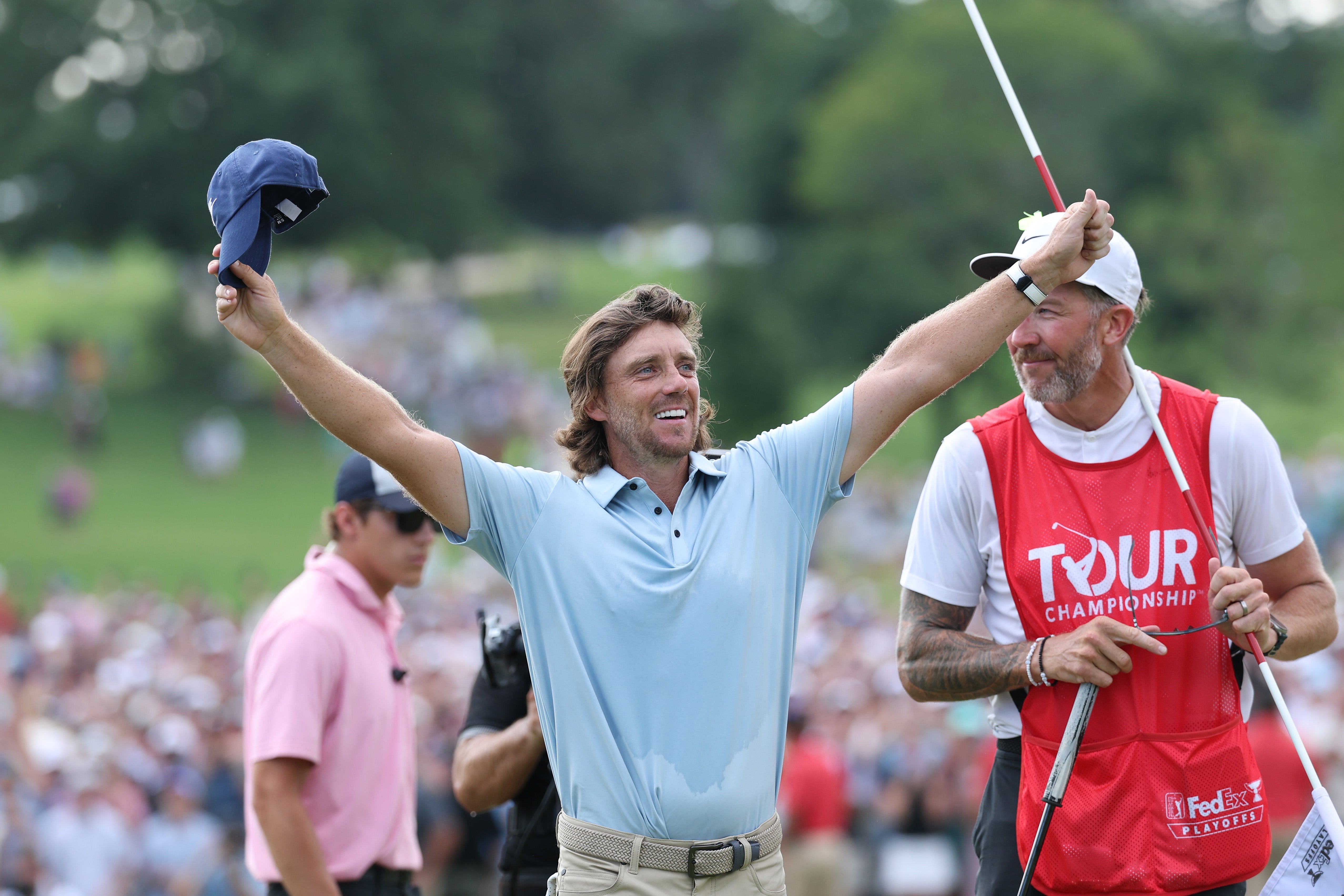 Tommy Fleetwood of England celebrates on the 18th green after winning the final round of the TOUR Championship 2025
