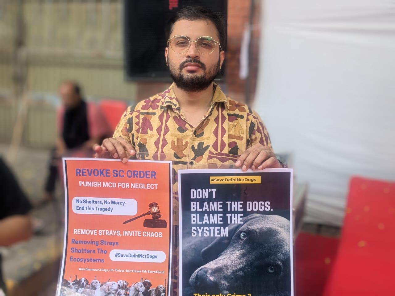 A demonstrator protests against the Indian Supreme Court order mandating that dogs be moved to shelters