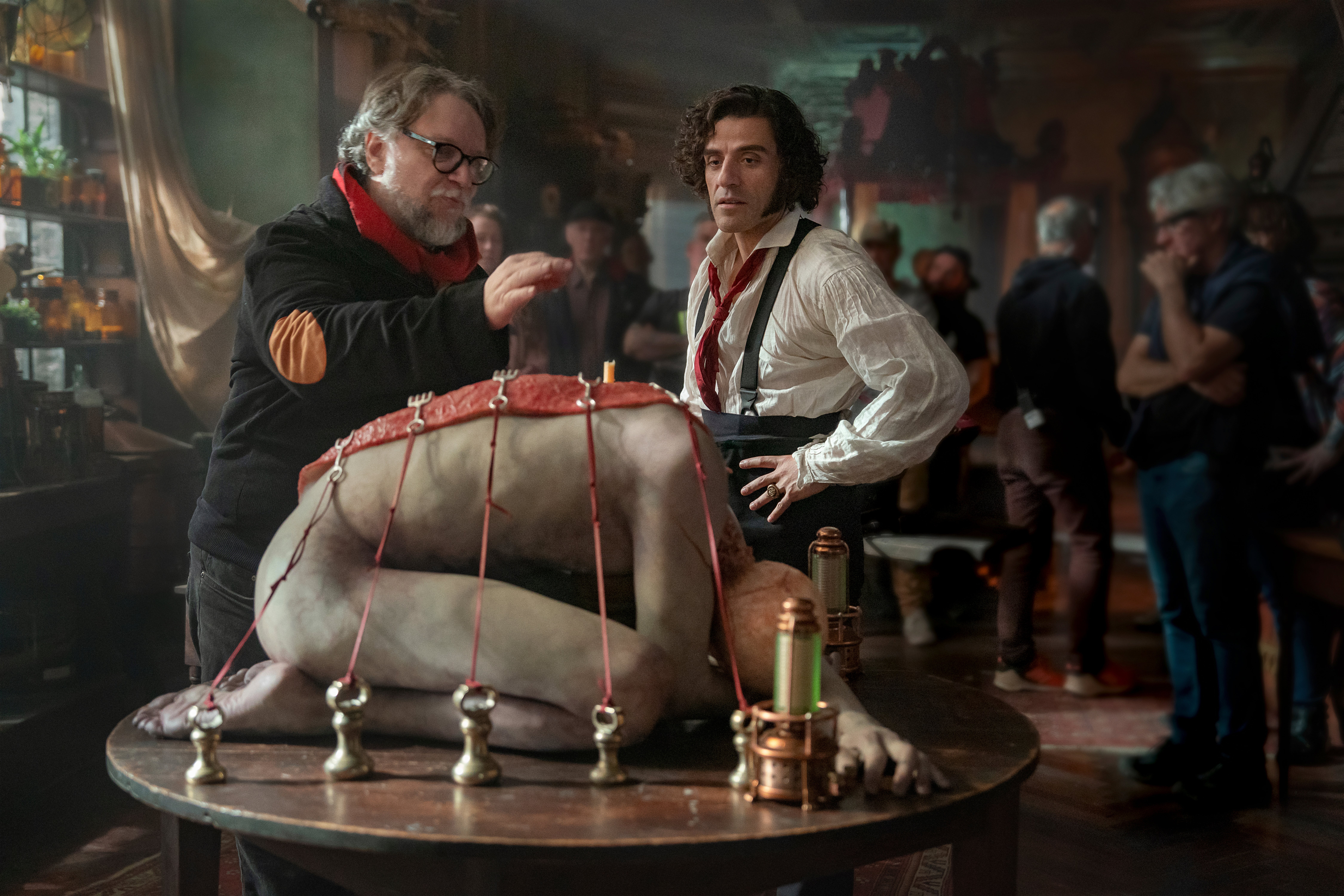 Director Guillermo del Toro, left, and Oscar Isaac on the set of ‘Frankenstein’; The film premiered on Saturday at the Venice Film Festival to a nearly 15-minute standing ovation