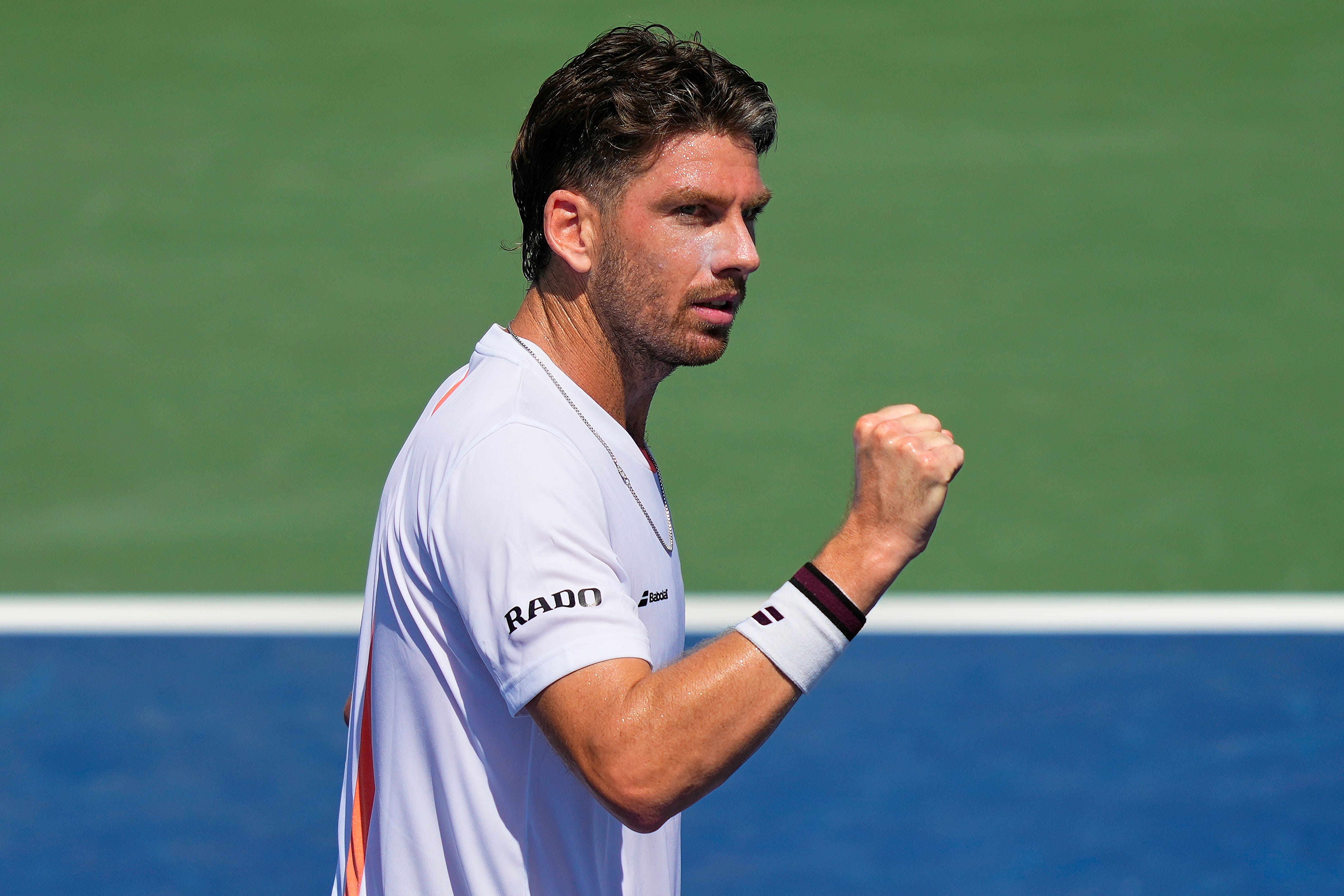 Cameron Norrie clenches his fist after winning a point (Yuki Iwamura/AP)