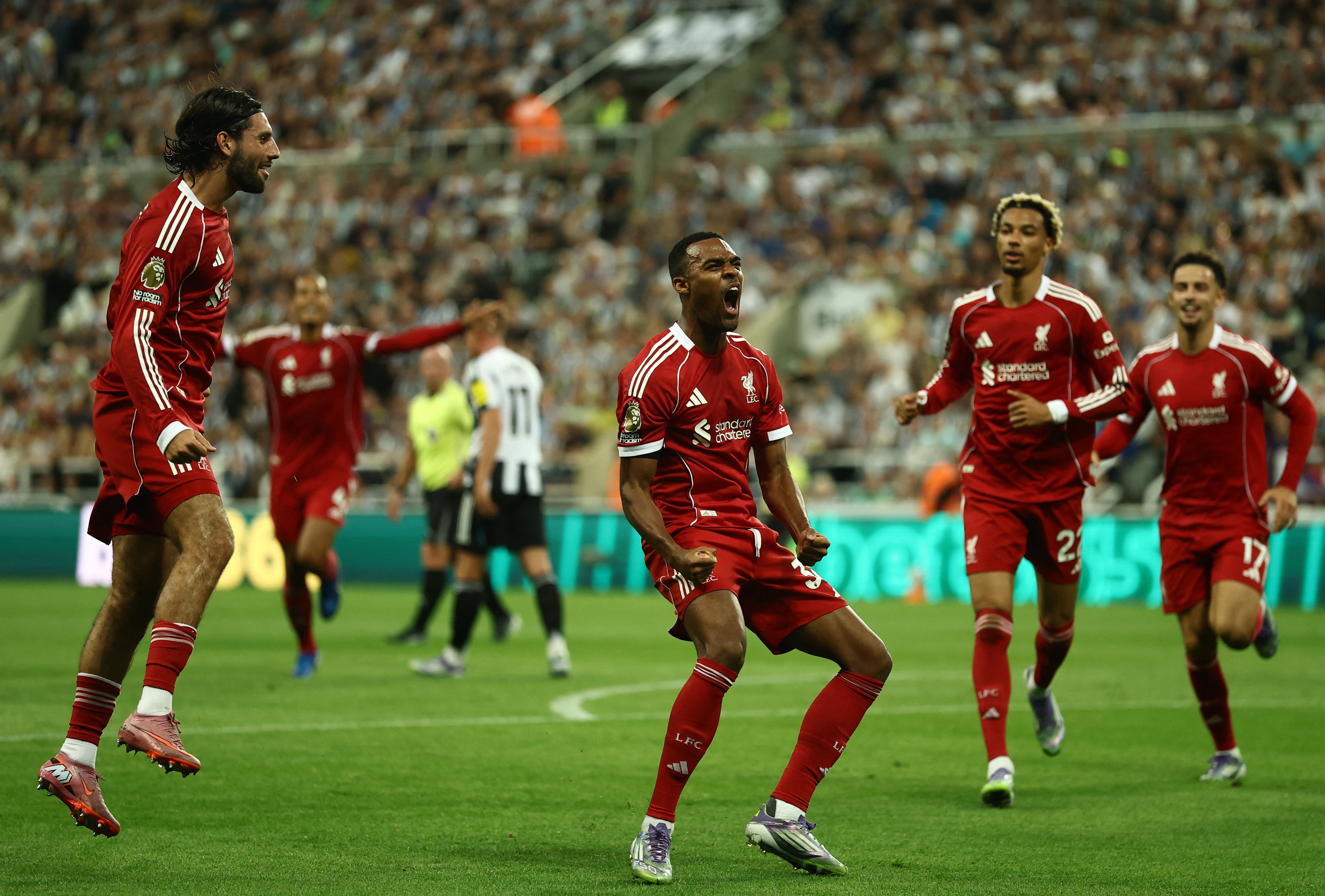 Ryan Gravenberch (centre) celebrates scoring against Newcastle this week
