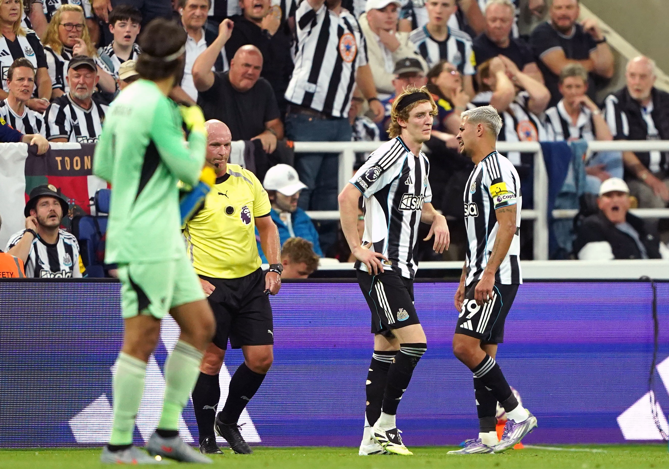 Anthony Gordon, second right, walks after being shown a red card (Owen Humphreys/PA)