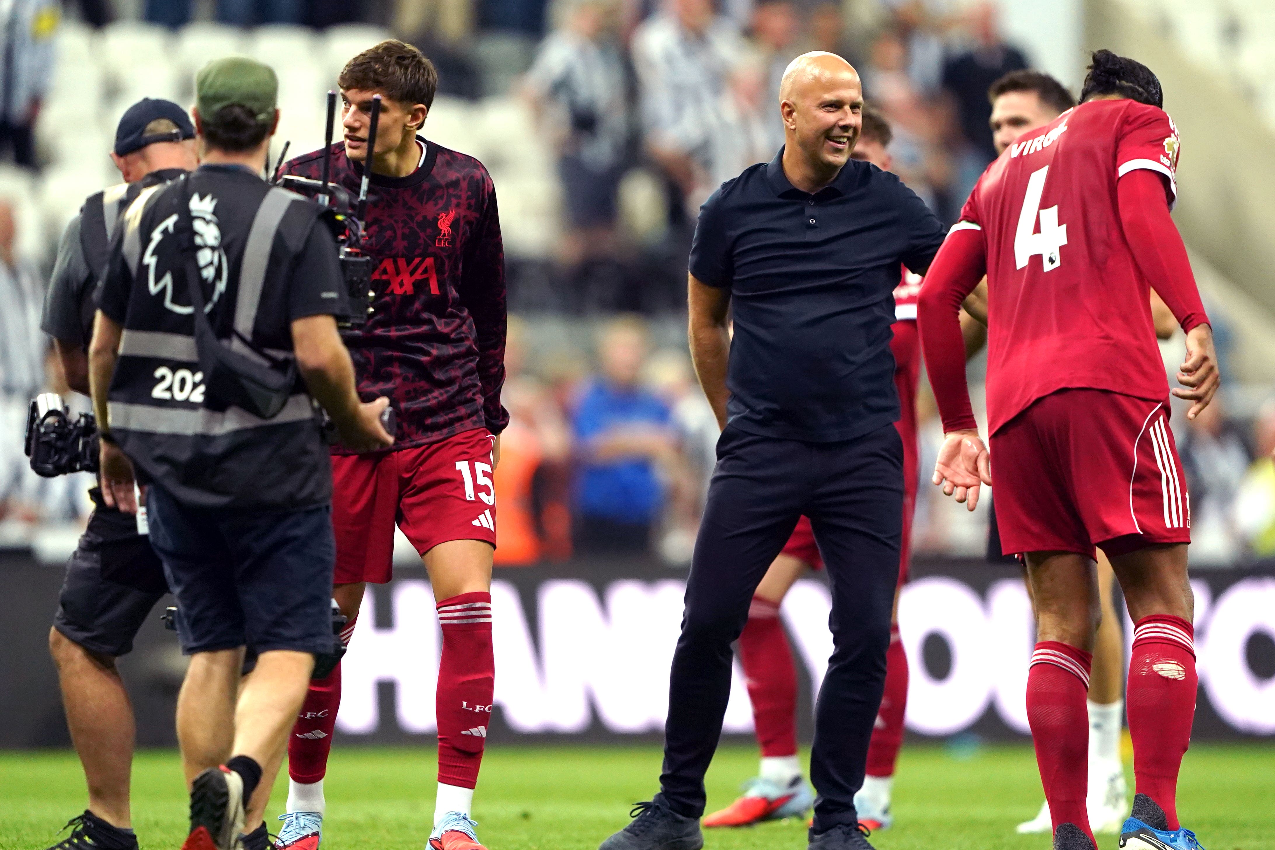 Liverpool manager Arne Slot congratulates Virgil van Dijk after the 3-2 win at Newcastle (Owen Humphreys/PA).