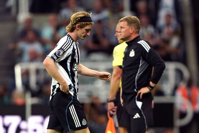 <p>Newcastle striker Anthony Gordon (left) was sent off for a first-half challenge on Liverpool skipper Virgil van Dijk (Owen Humphreys/PA)</p>