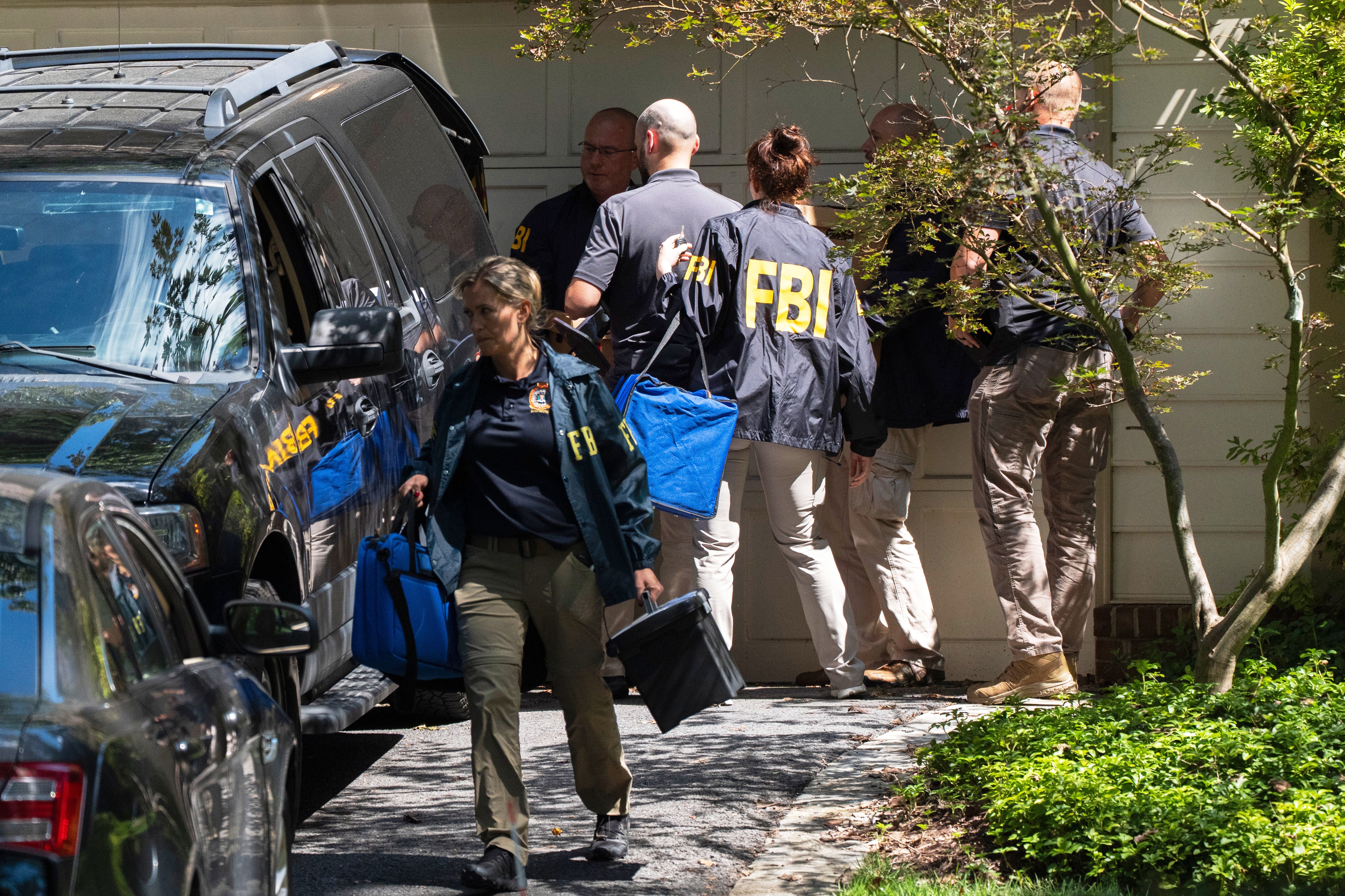 FBI agents leave the house of former national security adviser John Bolton in Bethesda, Maryland as part of the ‘early stages’ of an investigation related to classified documents, Vice President JD Vance has said
