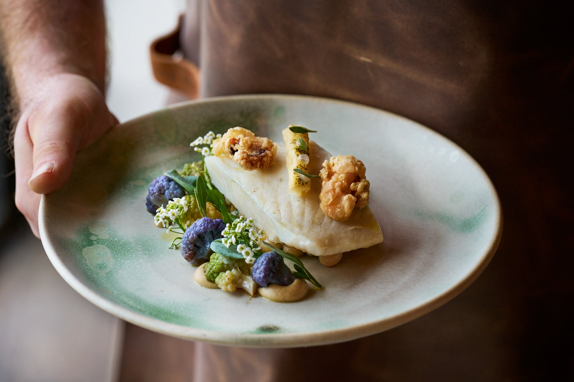 Steamed brill, caramelised cauliflower purée is an example of a dish on the menu at Zacry's on the seawall at Watergate Bay hotel, Cornwall