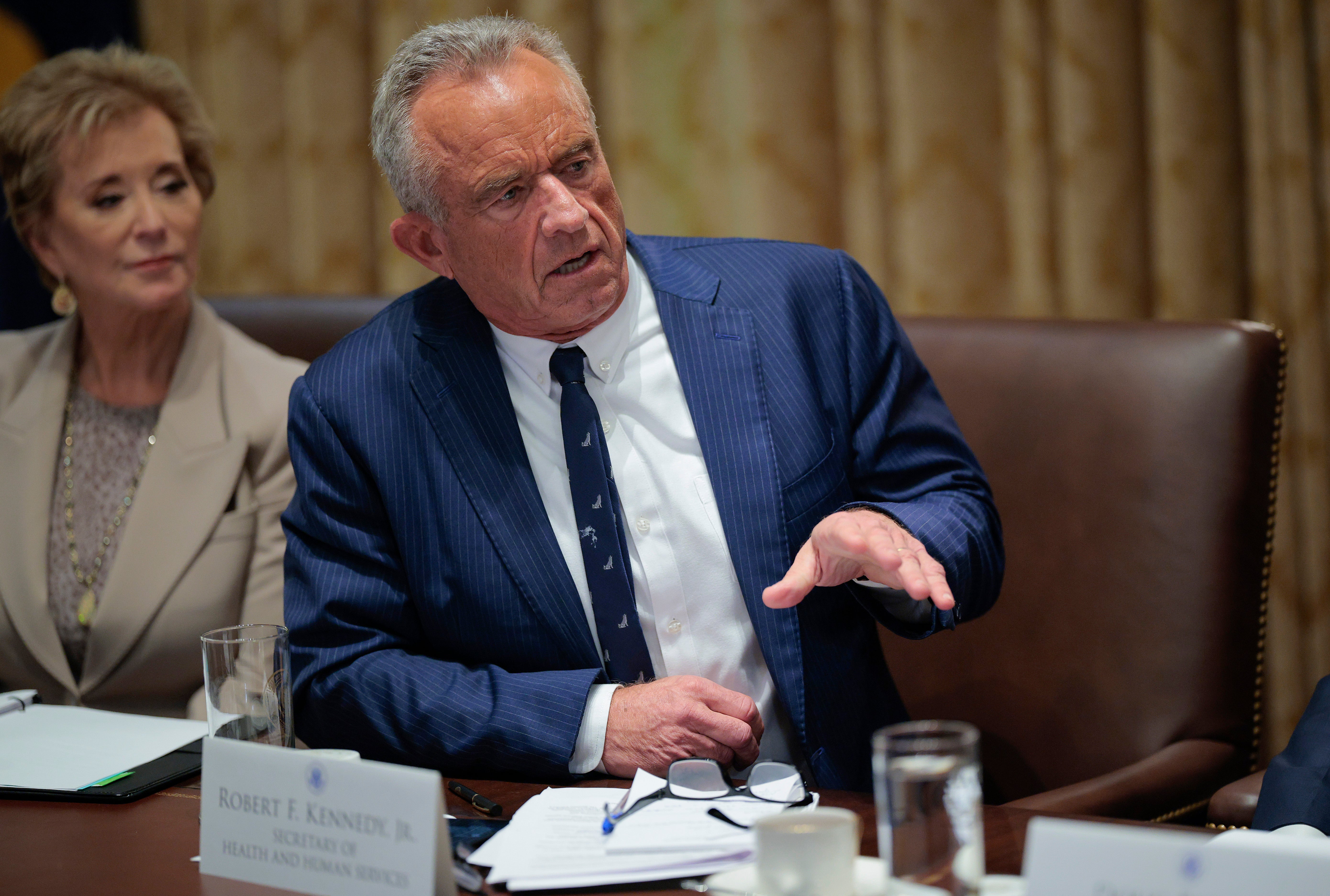 U.S. Secretary of Health and Human Services Robert F. Kennedy Jr. speaks alongside Education Secretary Linda McMahon as President Donald Trump holds a cabinet meeting.