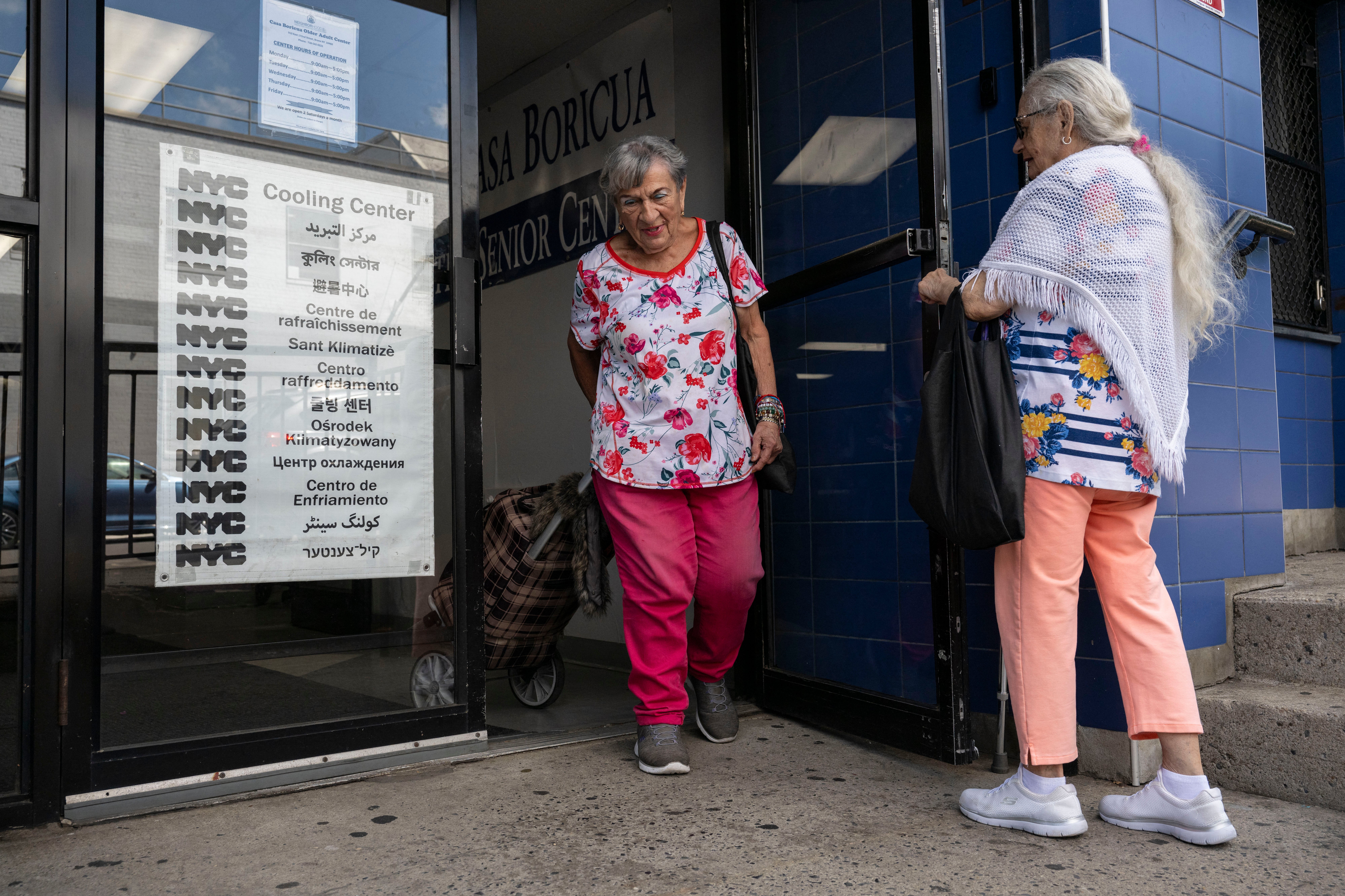 Senior citizens leave a cooling center last summer in New York’s Bronx neighborhood. A new analysis has found many older adults are unprepared for the dangerous effects of heat waves