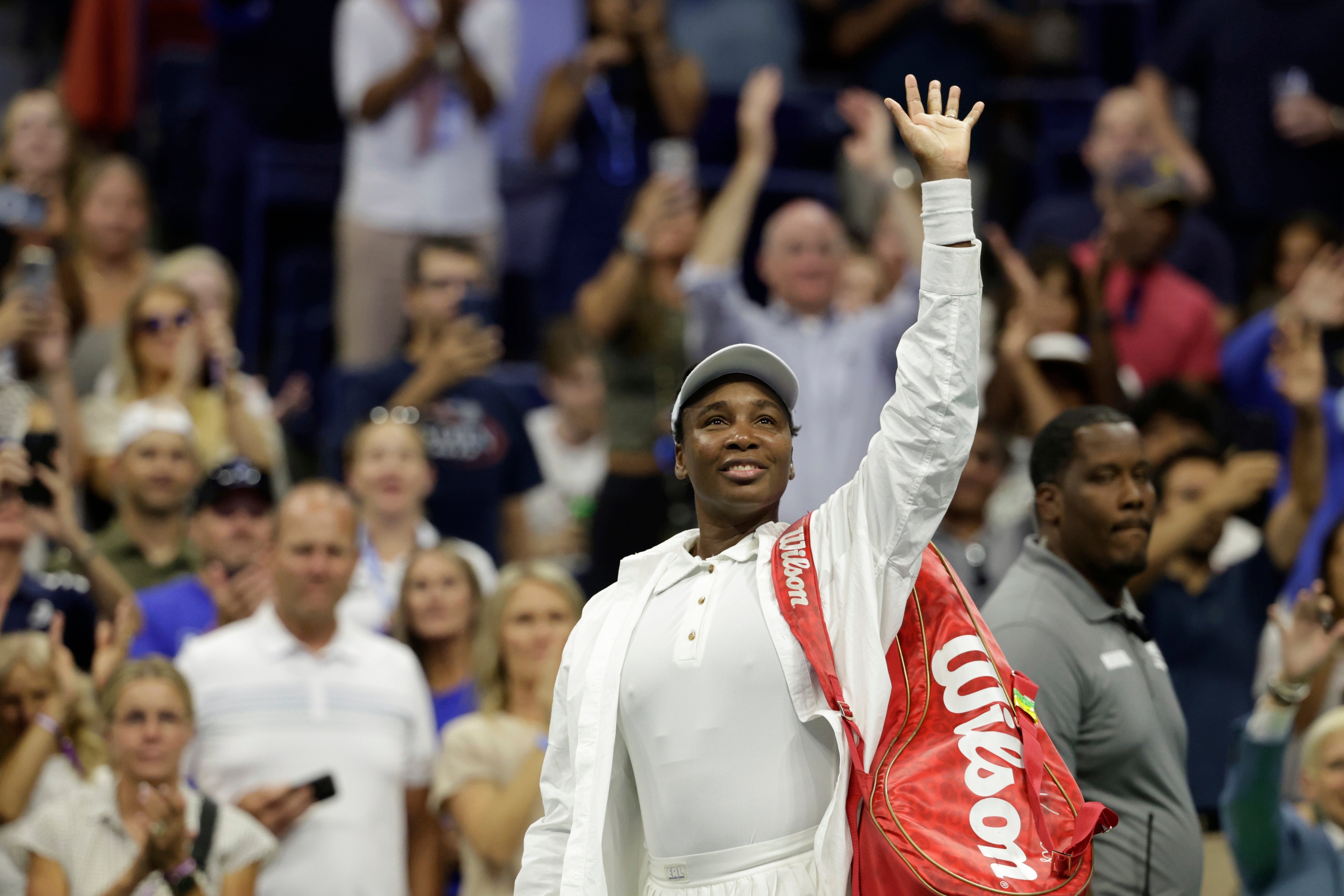 Venus Williams waves to fans after being defeated by Karolina Muchova