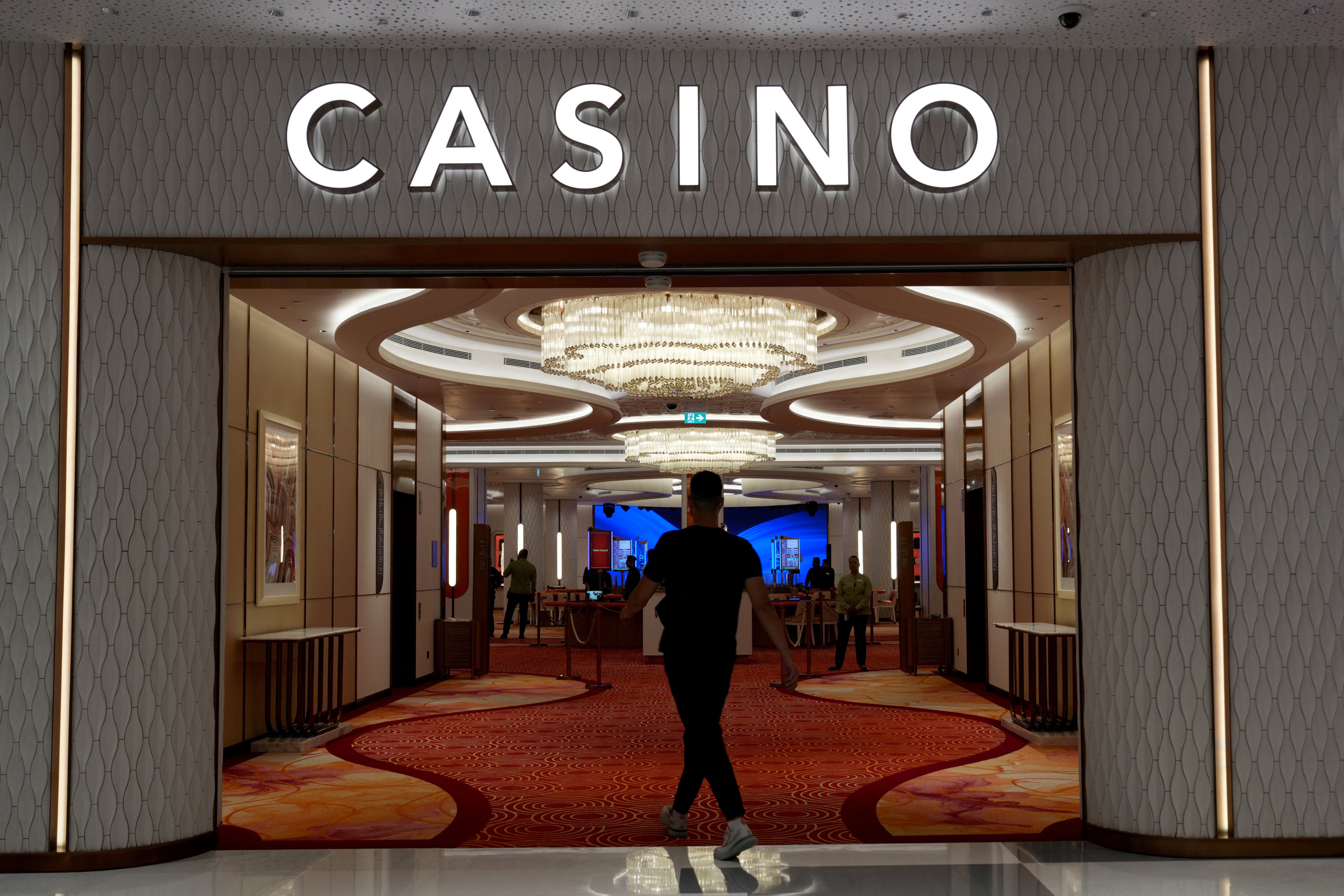 A man enters a casino at City of Dreams, an integrated resort that includes Sri Lanka's first high end casino, in Colombo, Sri Lanka
