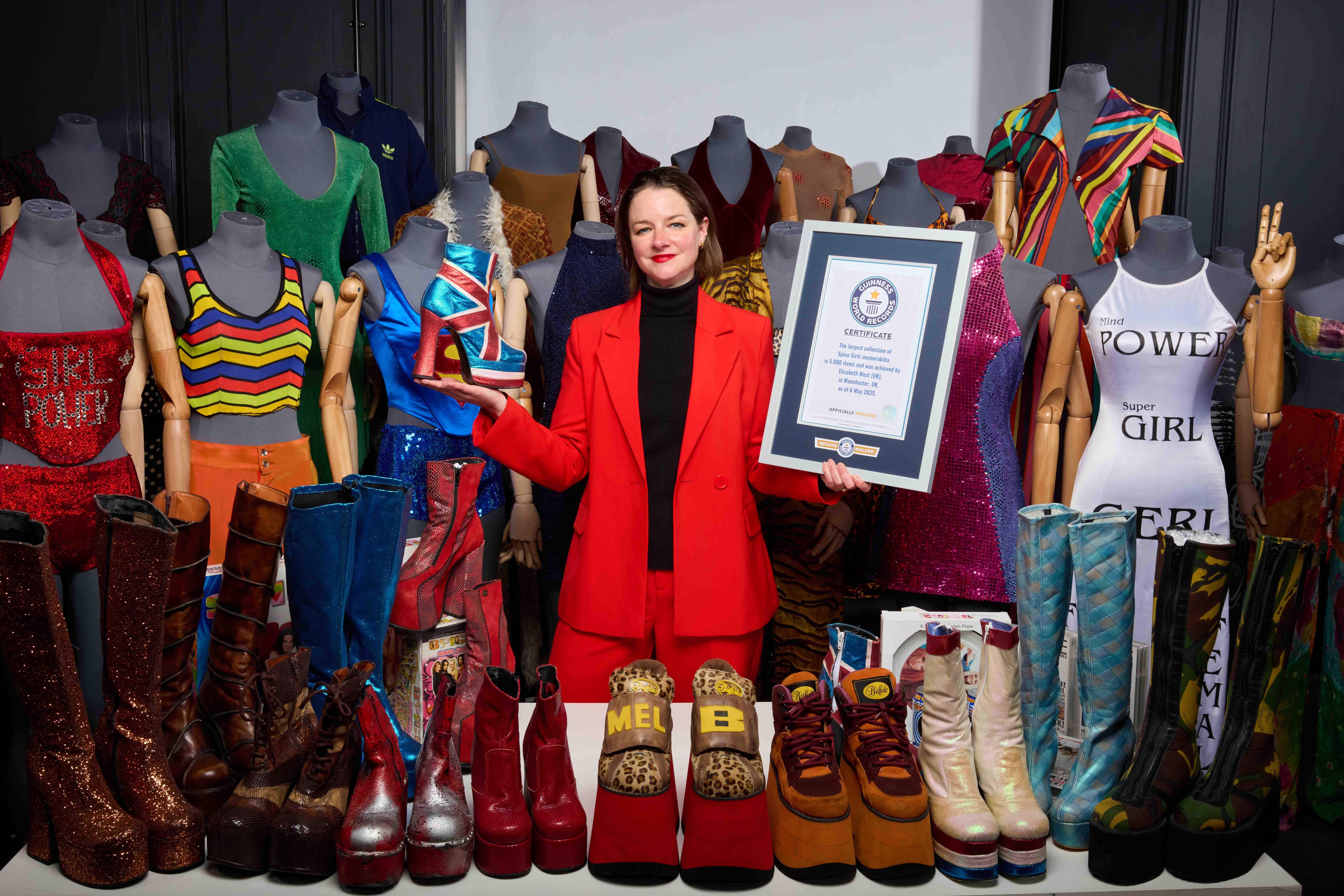 Liz West with a selection from the largest collection of Spice Girls memorabilia