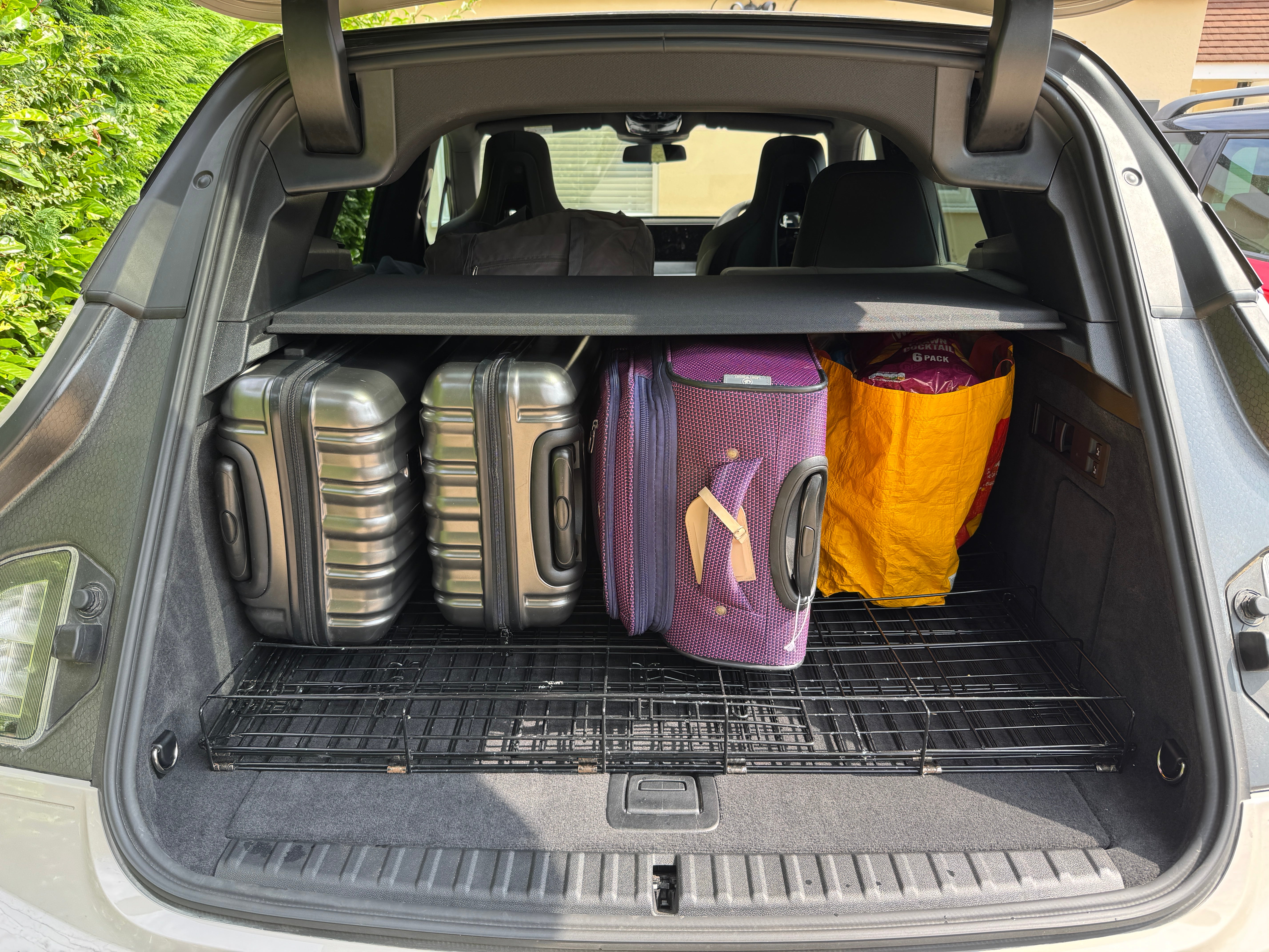 With two of the three rear seats folded, luggage and shopping for five people and two dogs all fitted into the BMW iX