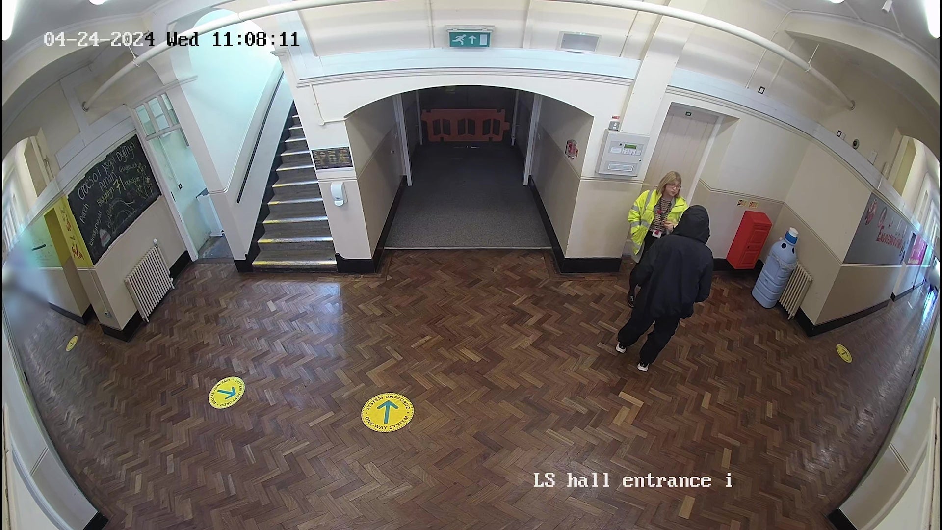 Screen grab taken from Ysgol Dyffryn Aman CCTV footage dated 24/04/24 issued by Dyfed-Powys Police of the 14-year-old girl speaking with teacher Fiona Elias (in a high-vis jacket) before the incident