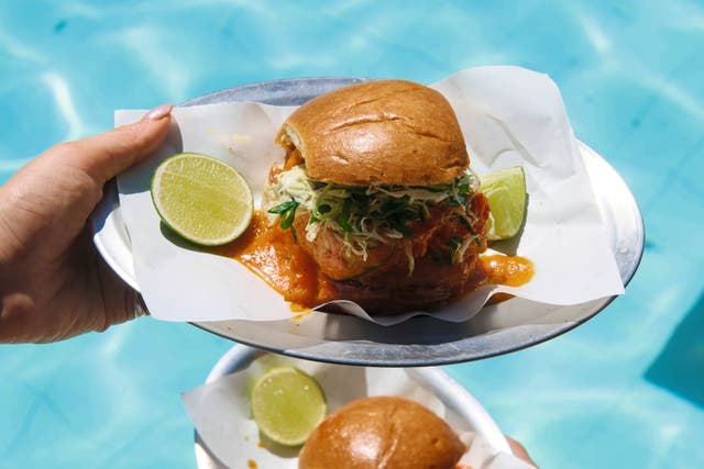 <p>A saucy spin on Bahia’s famous moqueca – this fish burger is made for dipping and dribbling</p>