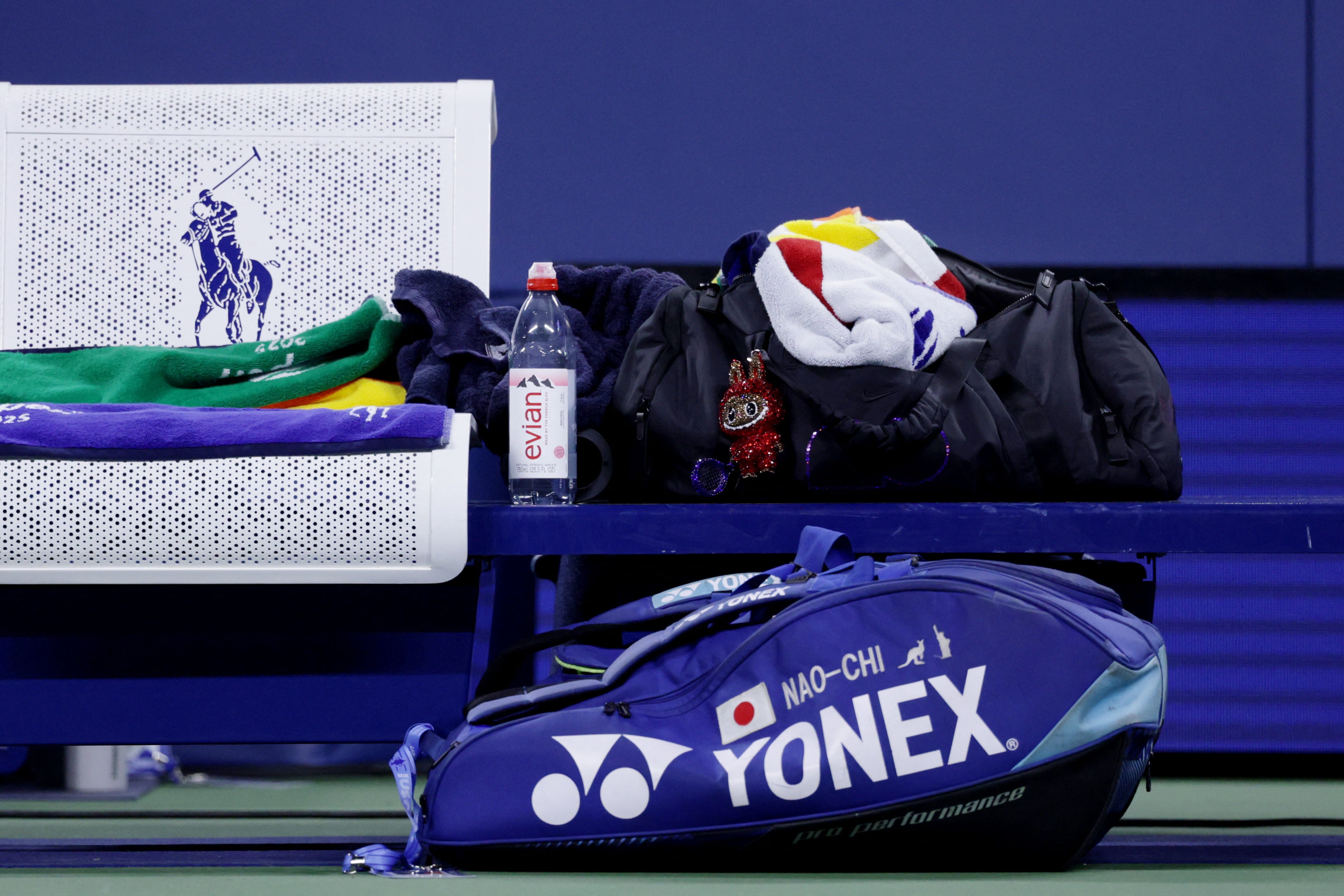 Naomi Osaka’s bag is seen during her first round match against Belgium's Greet Minnen - complete with red Labubu