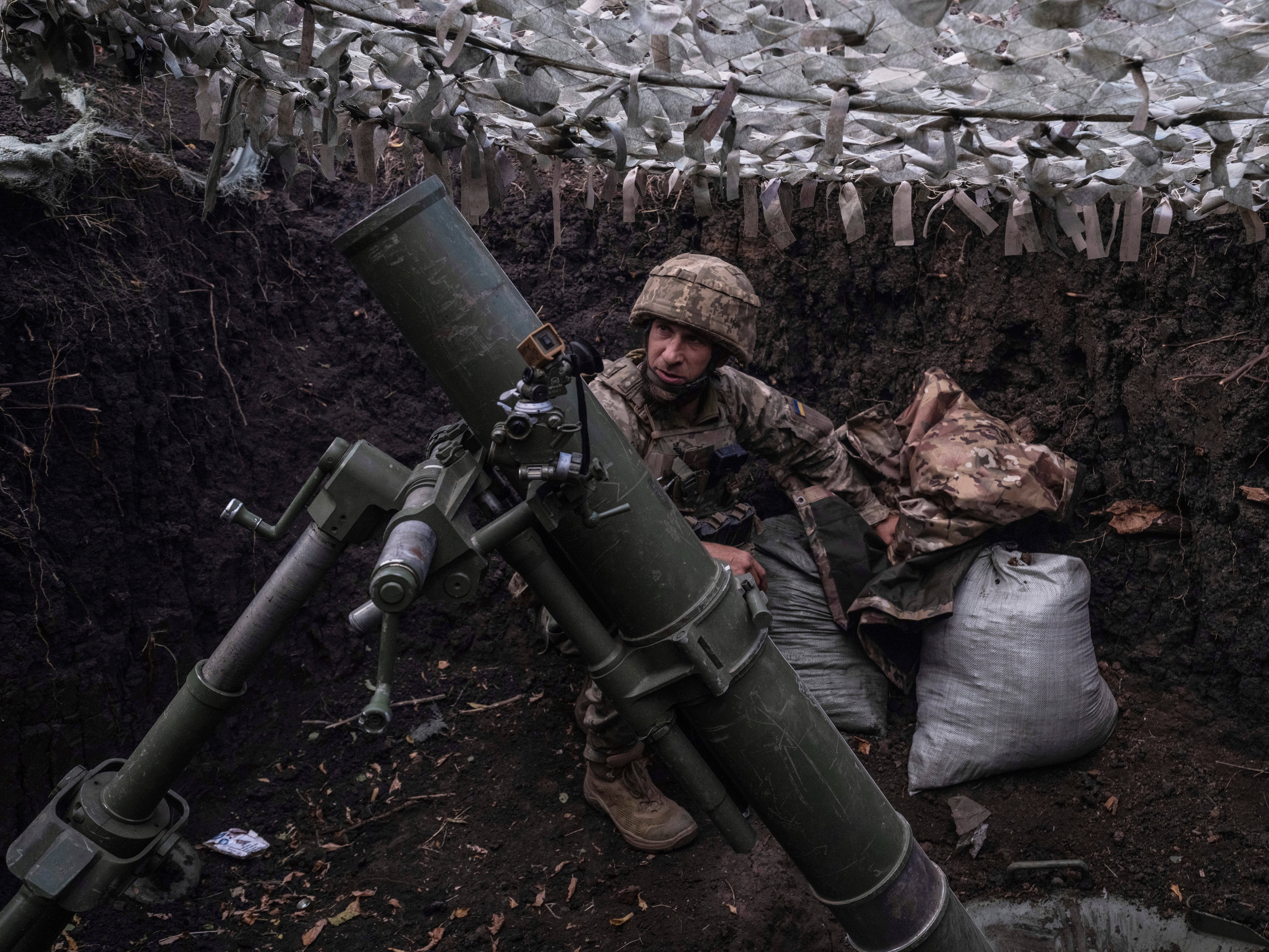 In this photo provided by Ukraine’s 93rd Kholodnyi Yar Separate Mechanised Brigade press service, a soldier fires a mortar towards the positions of Russian troops near Kostyantynivka in the Donetsk region, in August this year