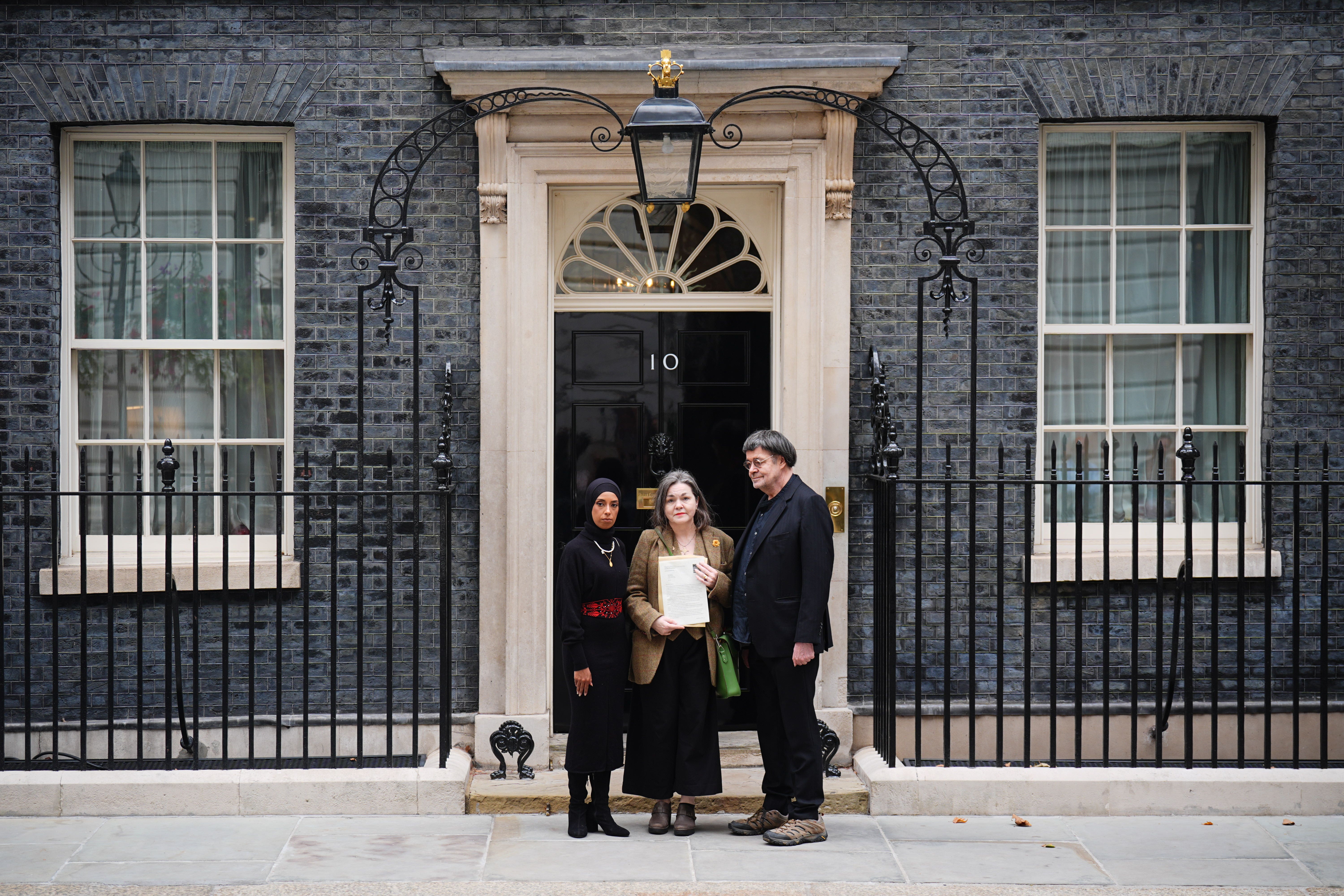 Representatives of the London Freelance NUJ branch outside Number 10. (Left to right) Mariam Elsayeh, Pennie Quinton, Mike Holderness (James Manning/PA)
