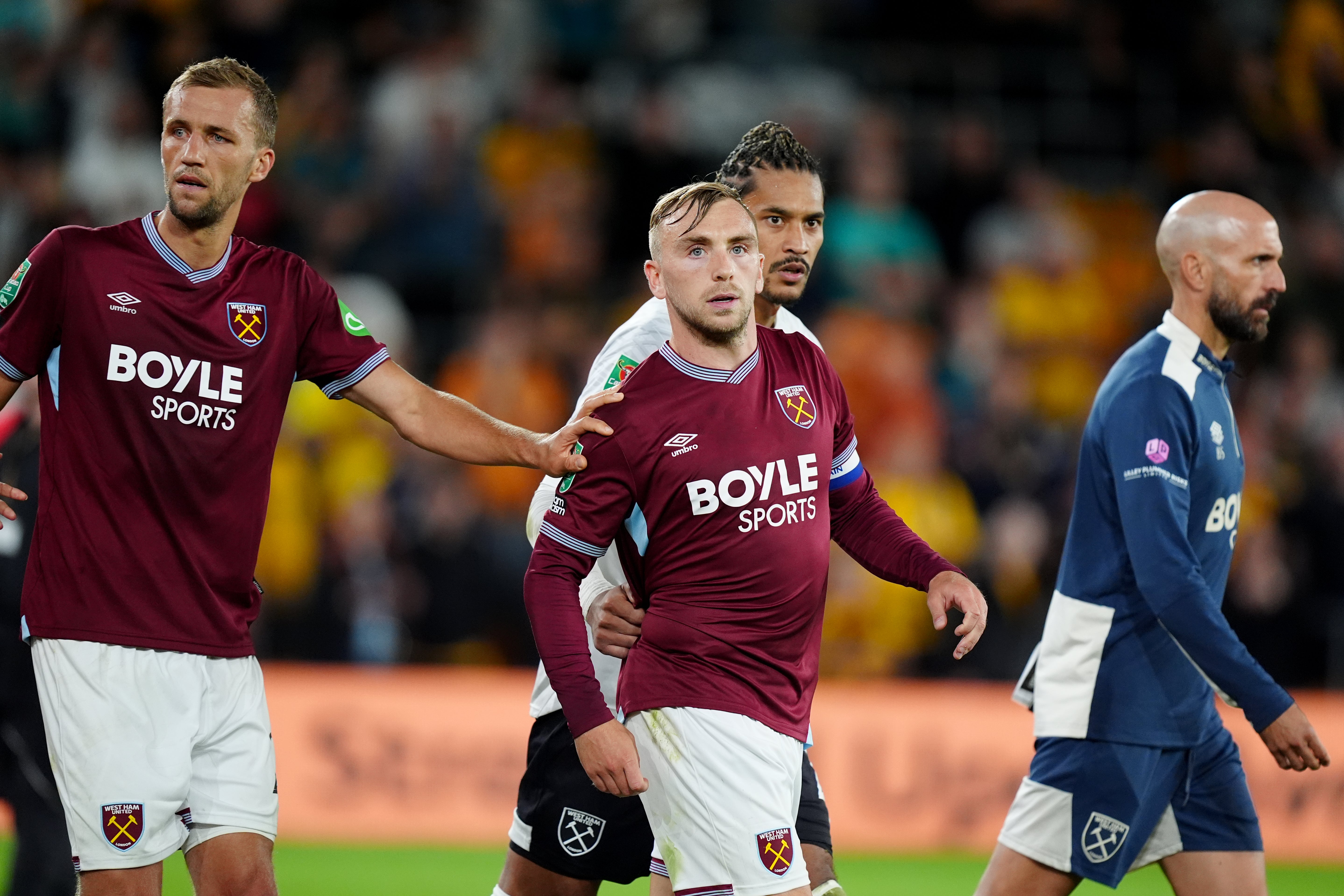 Bowen is pulled away by team-mates after confronting a fan