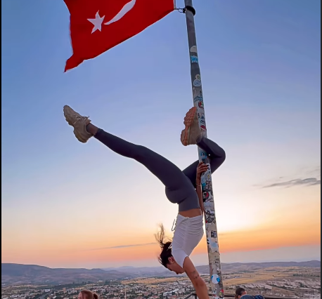 A gymnastic trainer used a pole for her dance video, that had the Turkish flag at the top