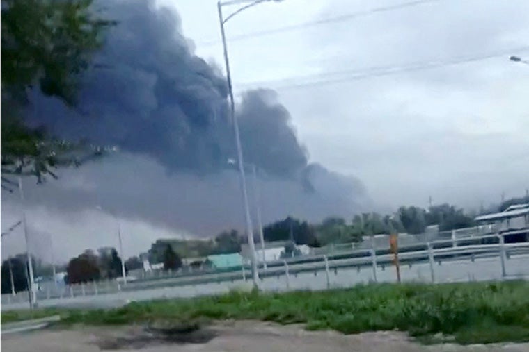 Smoke rises from a fire at an oil refinery following a Ukrainian drone attack in Russia’s Samara