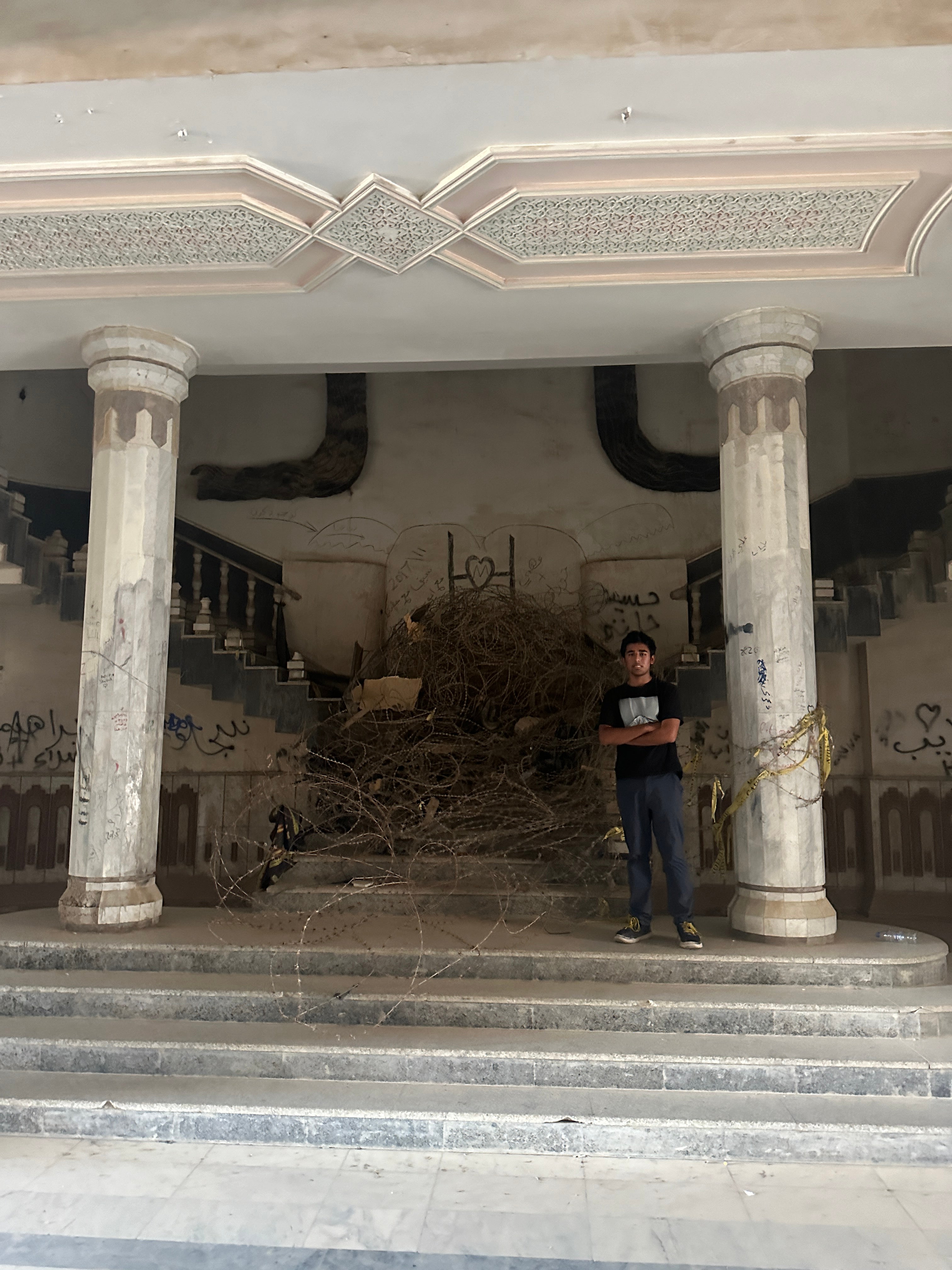 Afghanistan isn’t the only country that the teen visited that has a strained relationship with the U.S. Arjun said he had a 'wonderful seven days in Iraq' and is pictured inside Saddam Hussein's Babylon Palace.