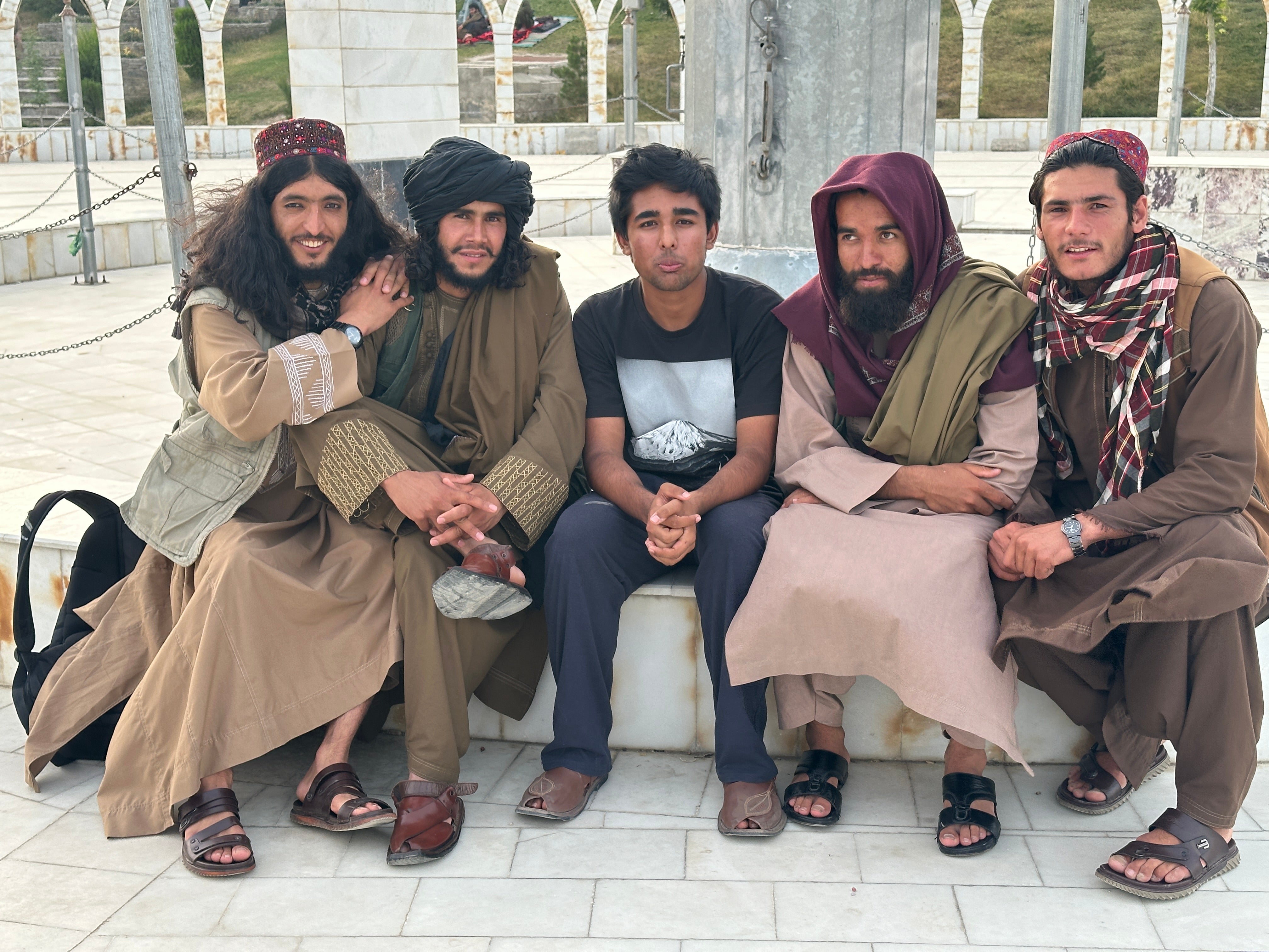 Teen globetrotter Arjun Malaviya with members of the Taliban in Afghanistan. He revealed that being a member of the group is seen as a regular job by many locals, who 'don't have crazy views.’