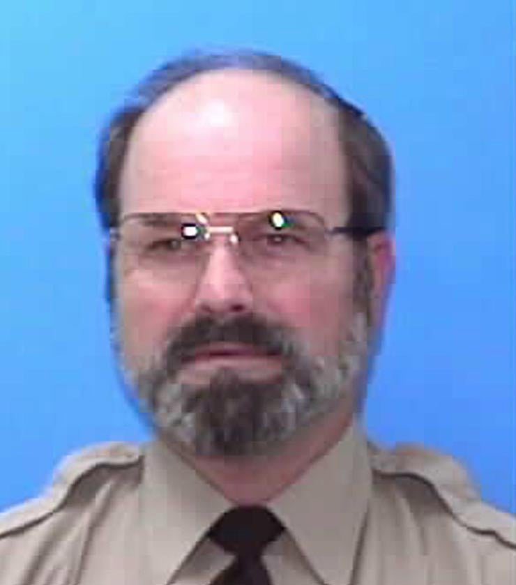 Dennis Rader, pictured in this undated driver's license photo, bound, tortured, and killed at least 10 victims between 1974 and 1991