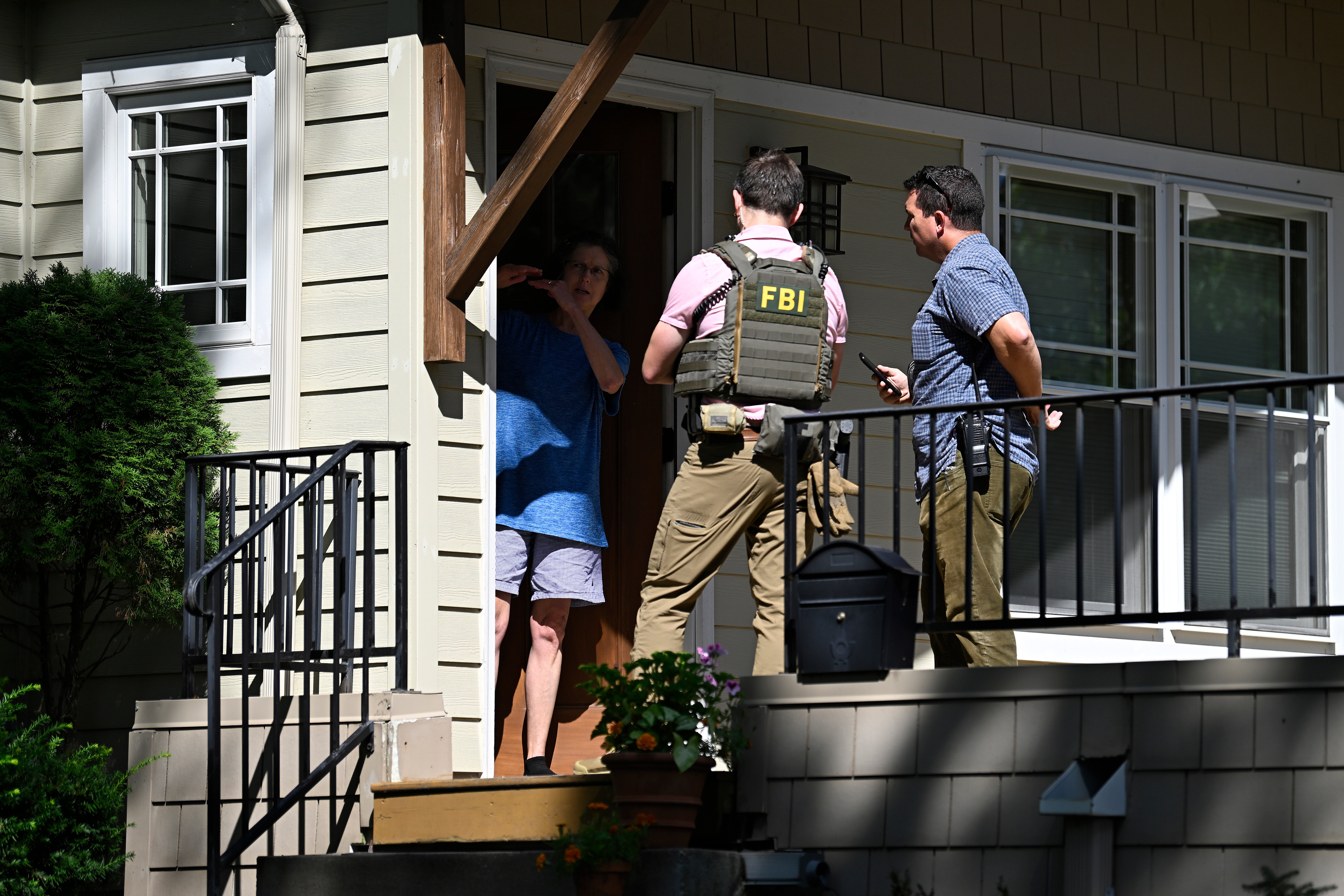 After a deadly school shooting on Wednesday, law enforcement canvassed the Minneapolis neighborhood where suspect Robin Westman lived with his father and stepmother. A resident who lives across the street from the Westmans said he was ‘thunderstruck’ by the news