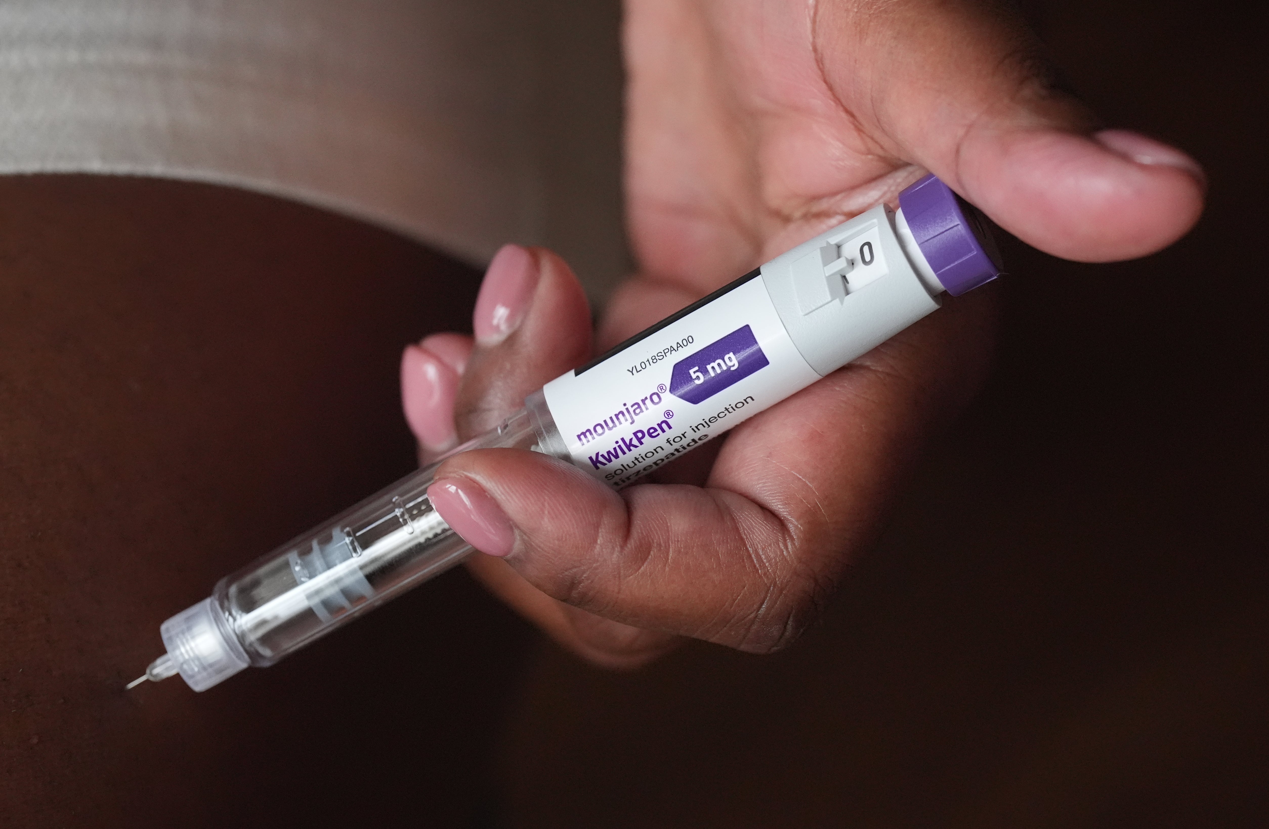 <p>A person uses a 5mg pre-filled injection pen of Mounjaro</p>