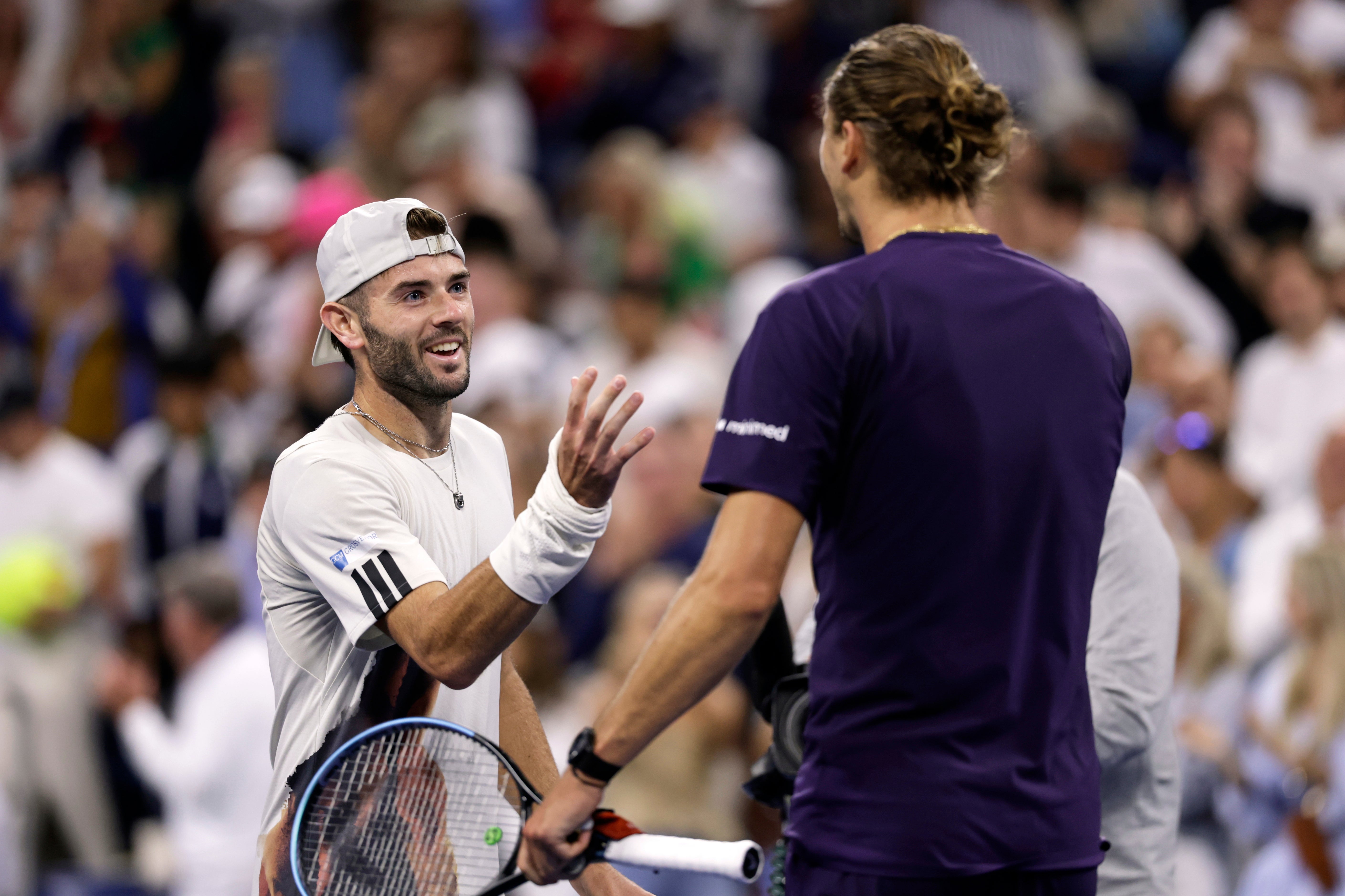 Alexander Zverev, right, shakes hands with Jacob Fearnley (Adam Hunger/AP)