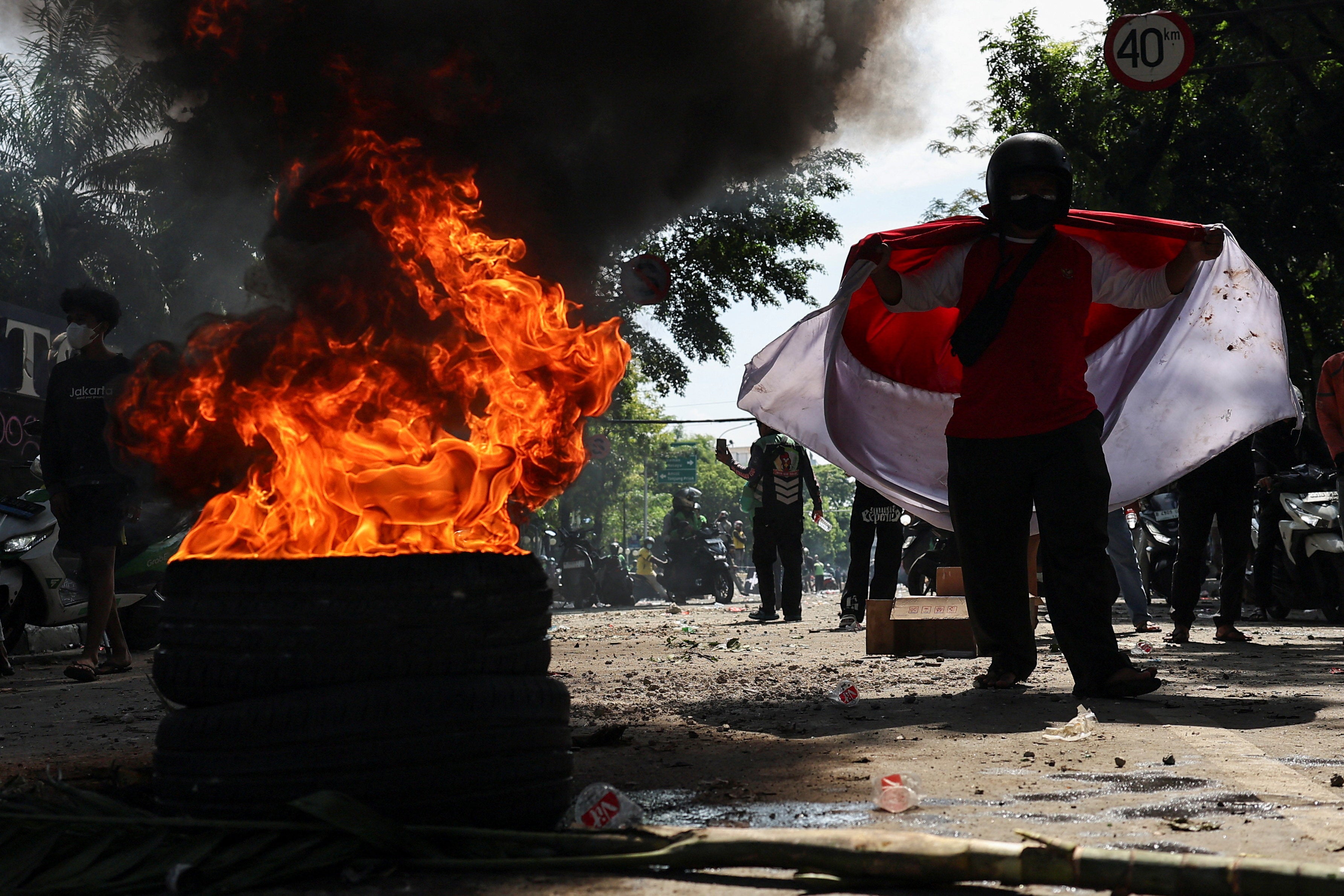 Protesters clash with riot police near Parliament