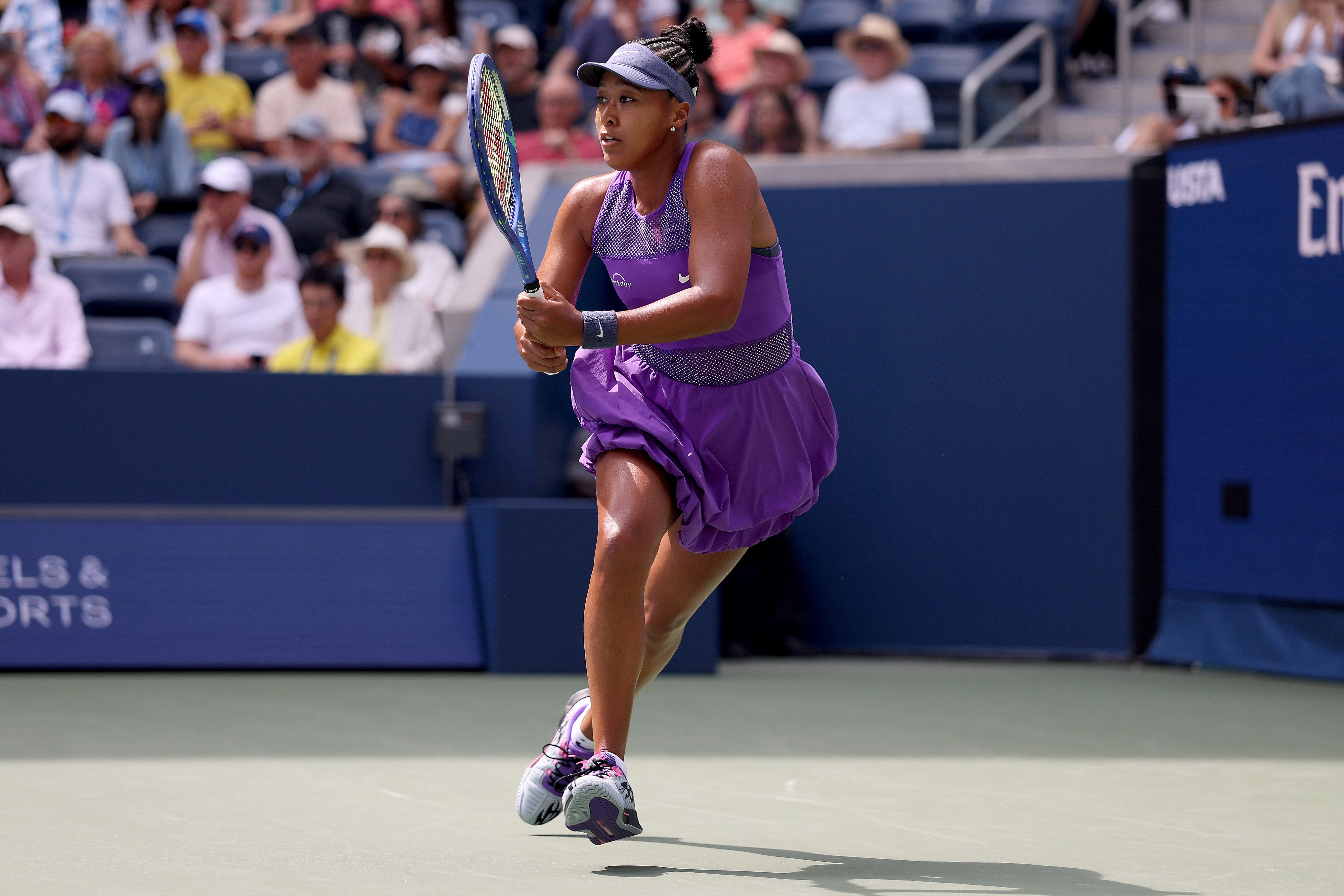 Naomi Osaka defeated Hailey Baptiste during the Women's Singles Second Round match on August 29. She stood out in a purple bubble skirt, which matched her sparkled tank top and visor hat
