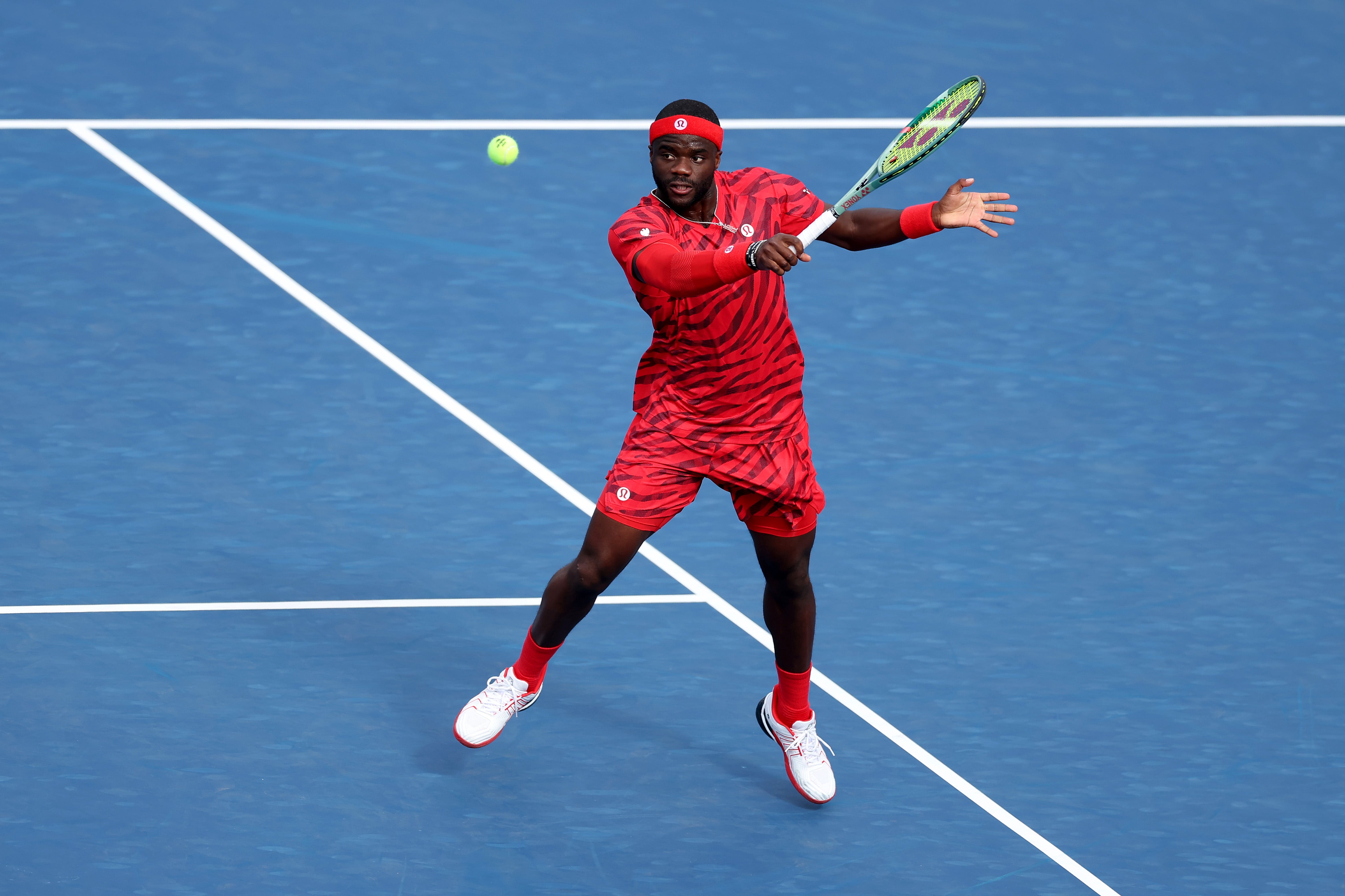 American Frances Tiafoe hit the court on August 27 in a matching red tiger-print shirt and shorts, paired with a red headband and wristbands — a bold choice that came off as a bit harsh on the eyes.