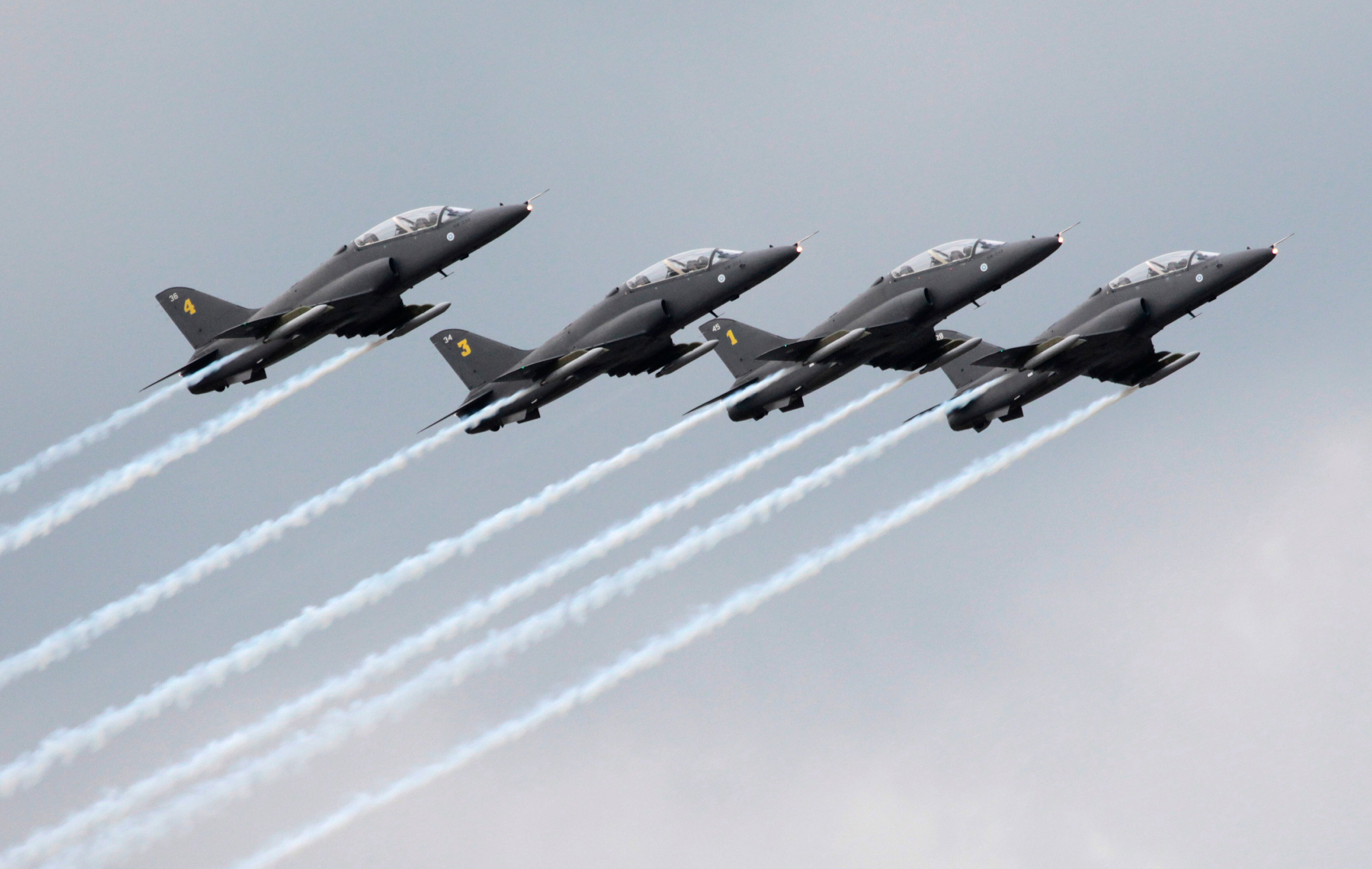 innish aerobatics group Midnight Hawks performs during a celebration marking the Russian air force's 100th anniversary in Zhukovsky, outside Moscow, Russia, on Aug. 11, 2012