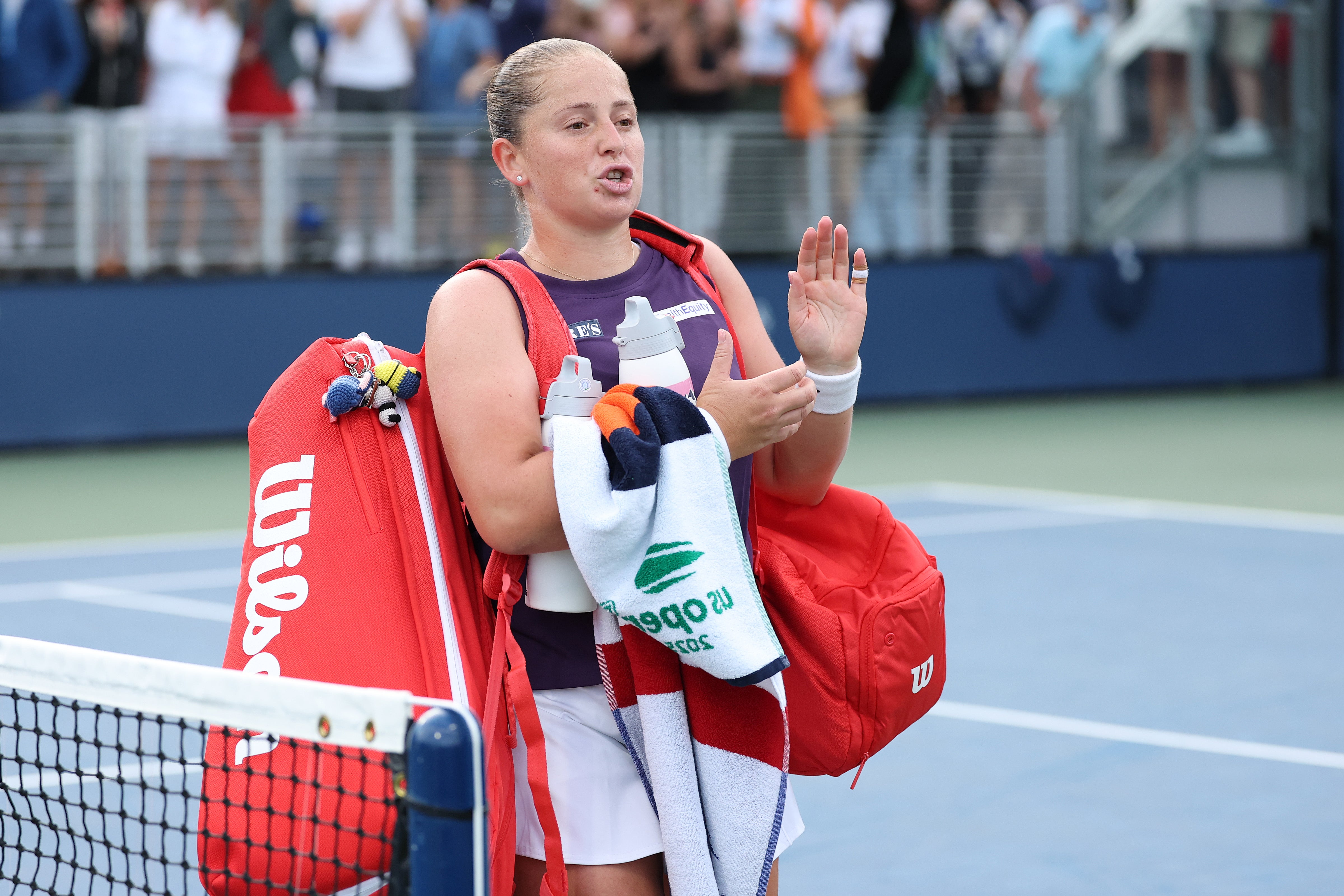 Jelena Ostapenko of Latvia reacts as she walks off the court after losing to Taylor Townsend of the United States