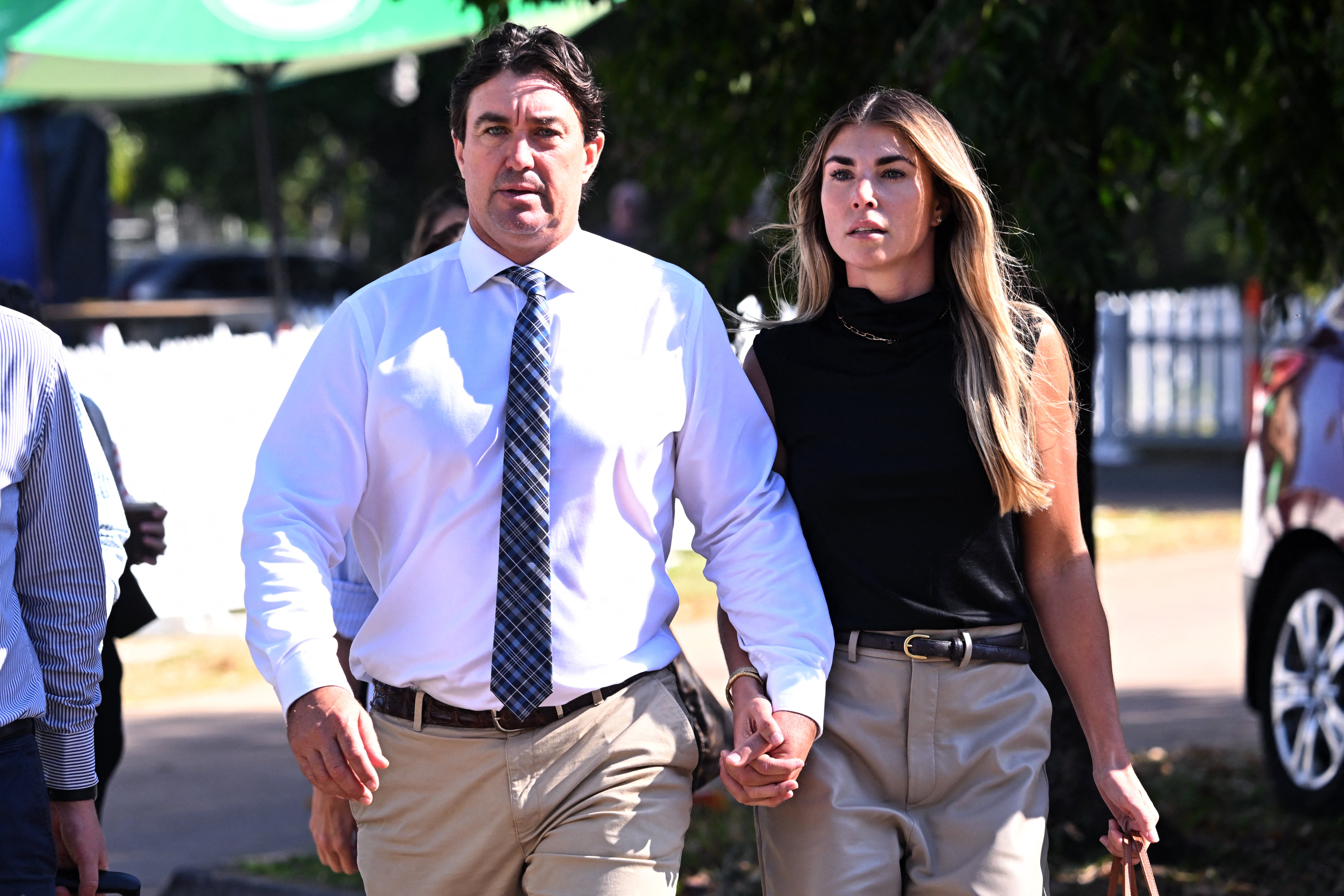 Matt Wright (L), the star of Netflix show Wild Croc Territory and National Geographic's Outback Wrangler, arrives with his wife Kaia Wright (R) at the Supreme Court in Darwin on 12 August 2025