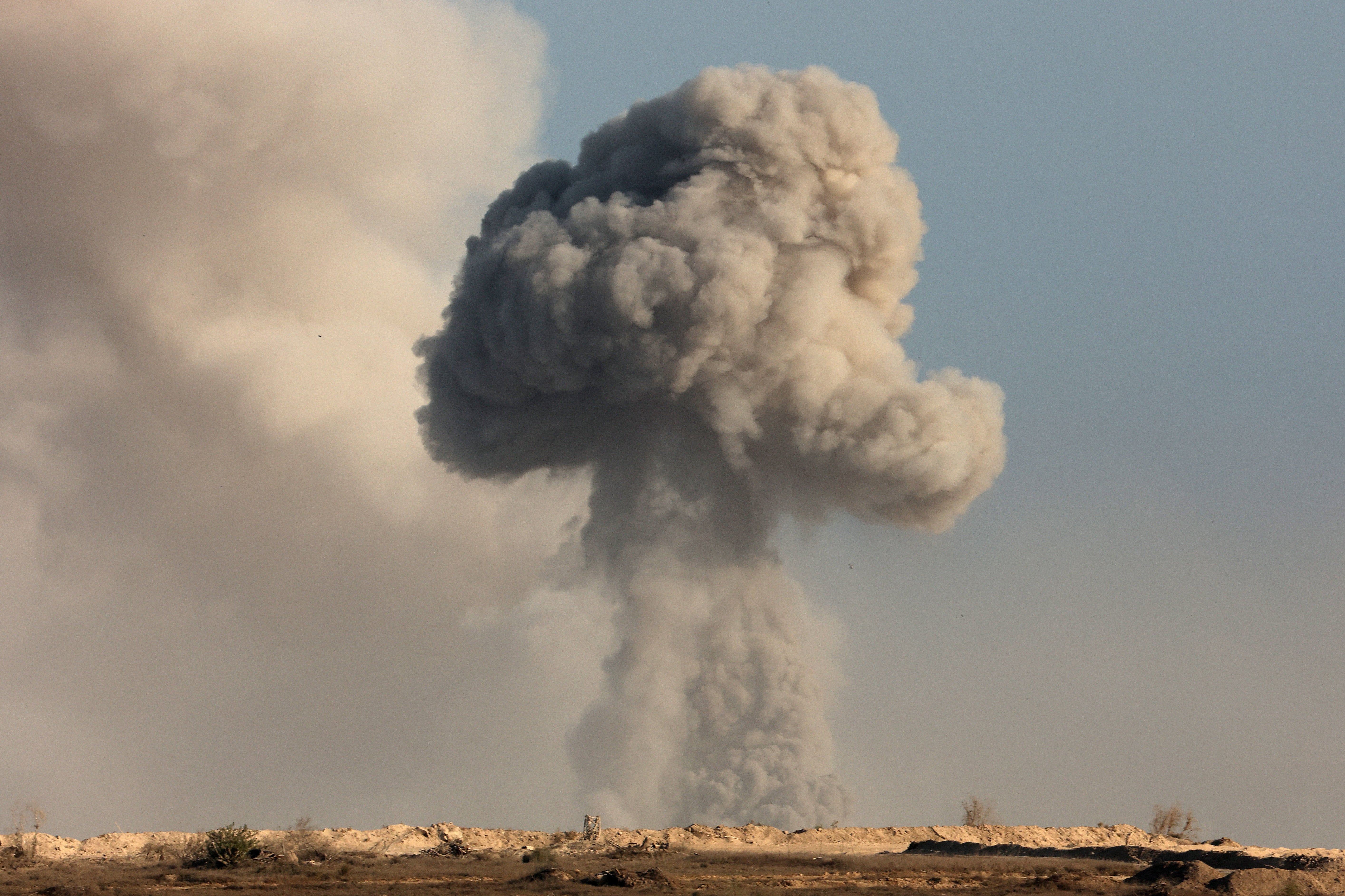 This picture taken from a position near Israel's border with the Gaza Strip shows smoke billowing during an Israeli strike on the besieged Palestinian territory, on August 29, 2025