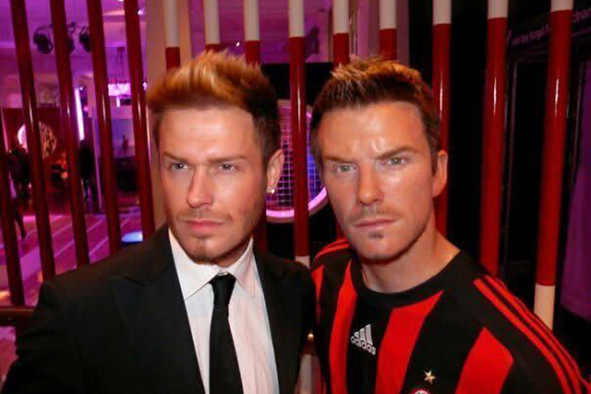 David Beckham lookalike Andy Harmer with a waxwork of the iconic footballer
