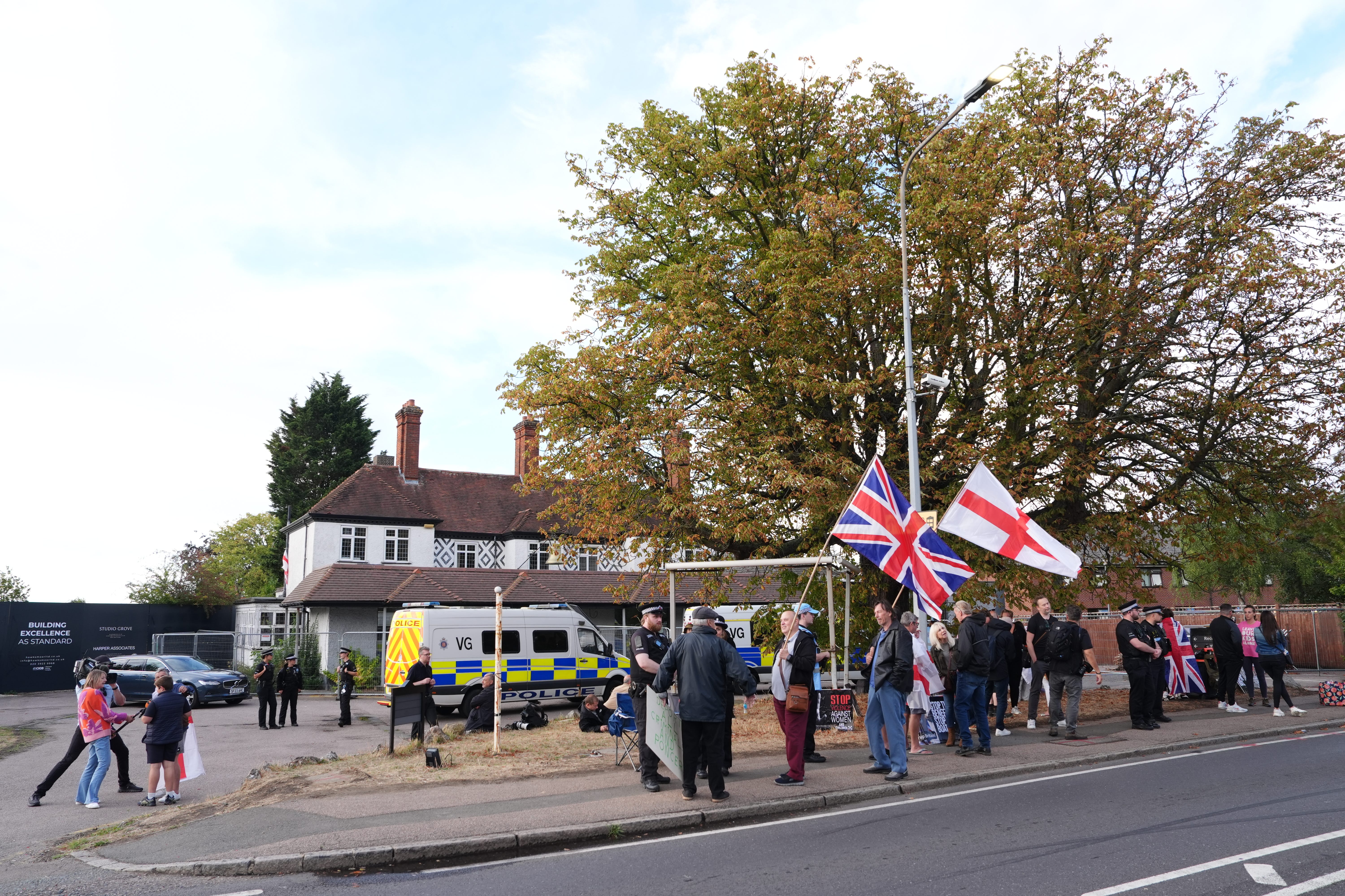 Police and protesters outside the Bell Hotel on Saturday (Jonathan Brady/PA)
