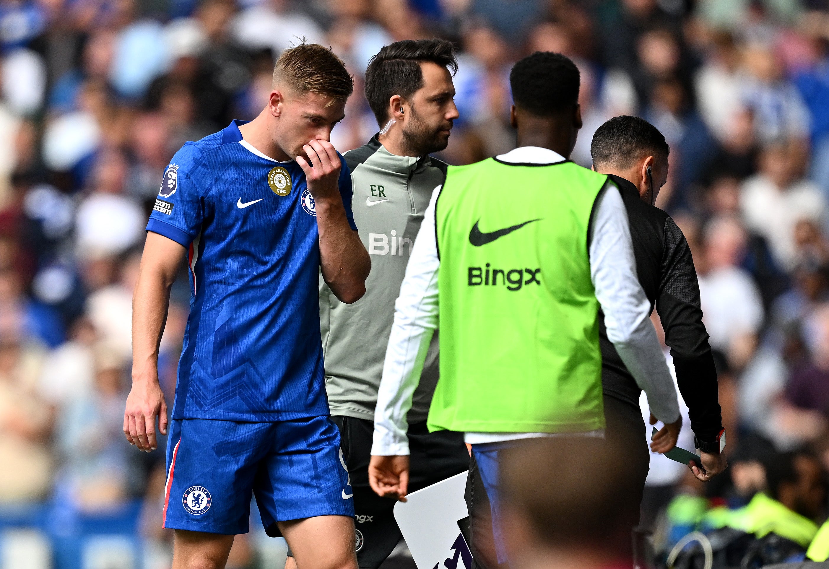 Liam Delap of Chelsea leaves the pitch following an injury