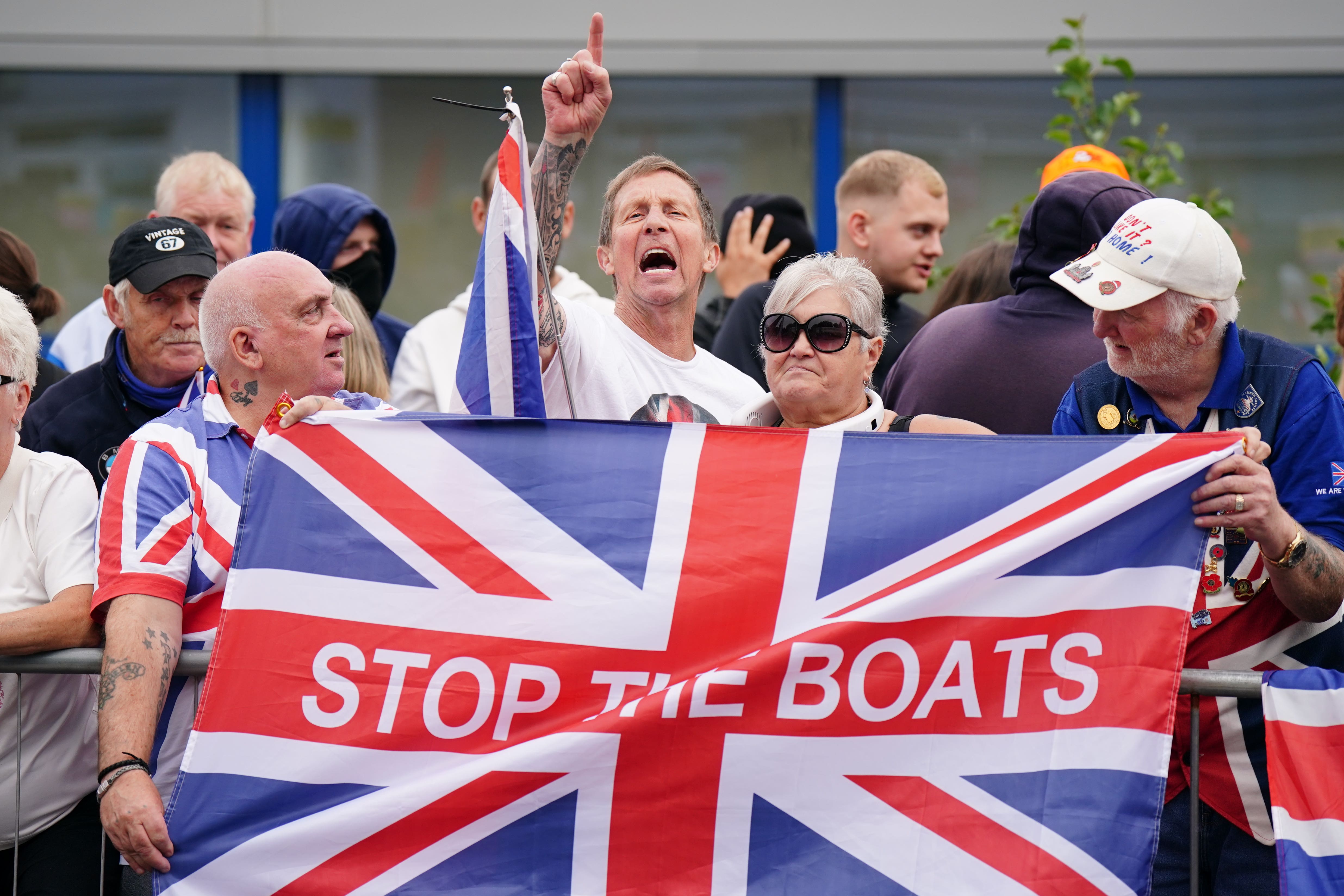 Activists outside the Cladhan Hotel in Falkirk (Jane Barlow/PA)