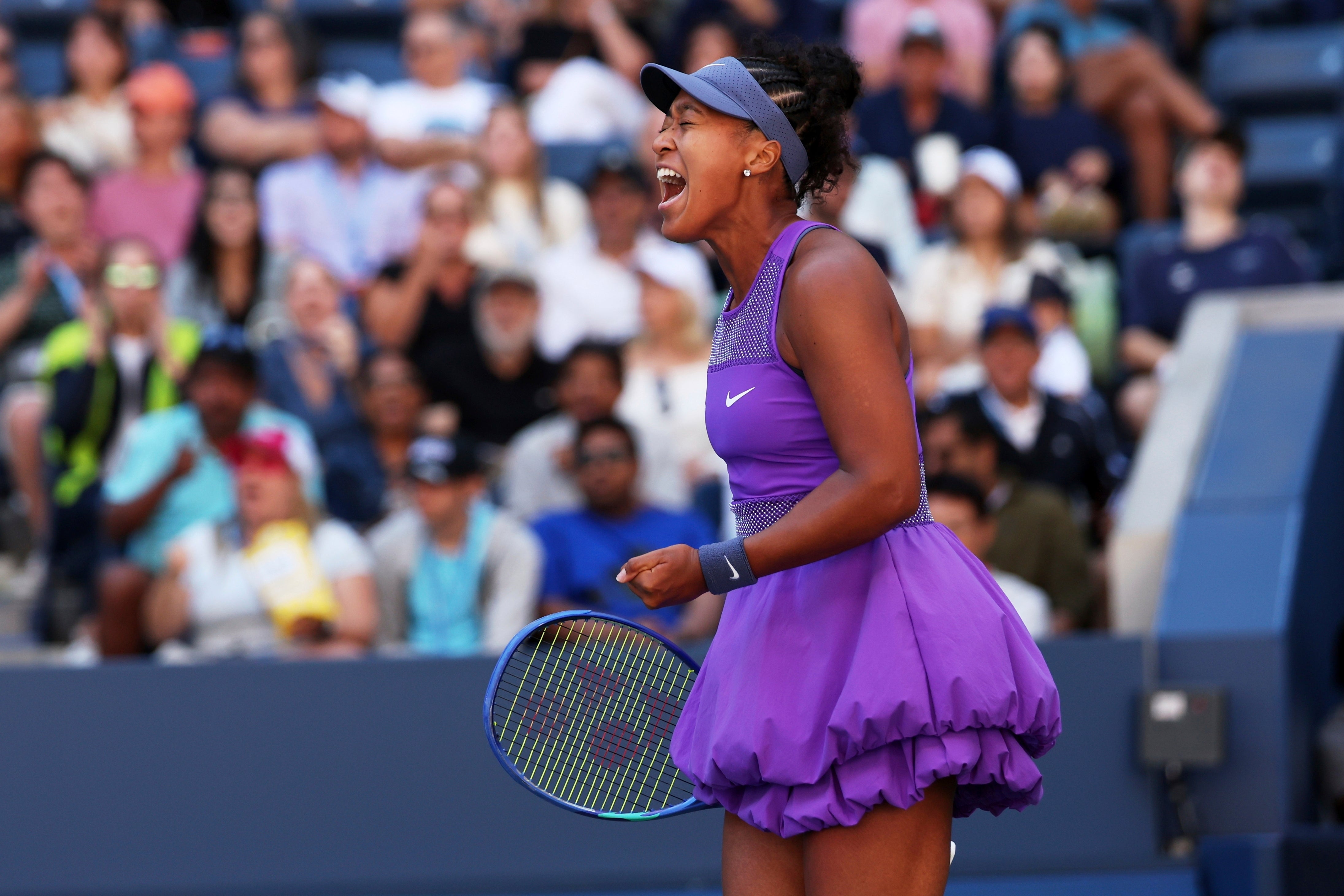 Naomi Osaka reacts to winning a point against Daria Kasatkina (Heather Khalifa/AP)