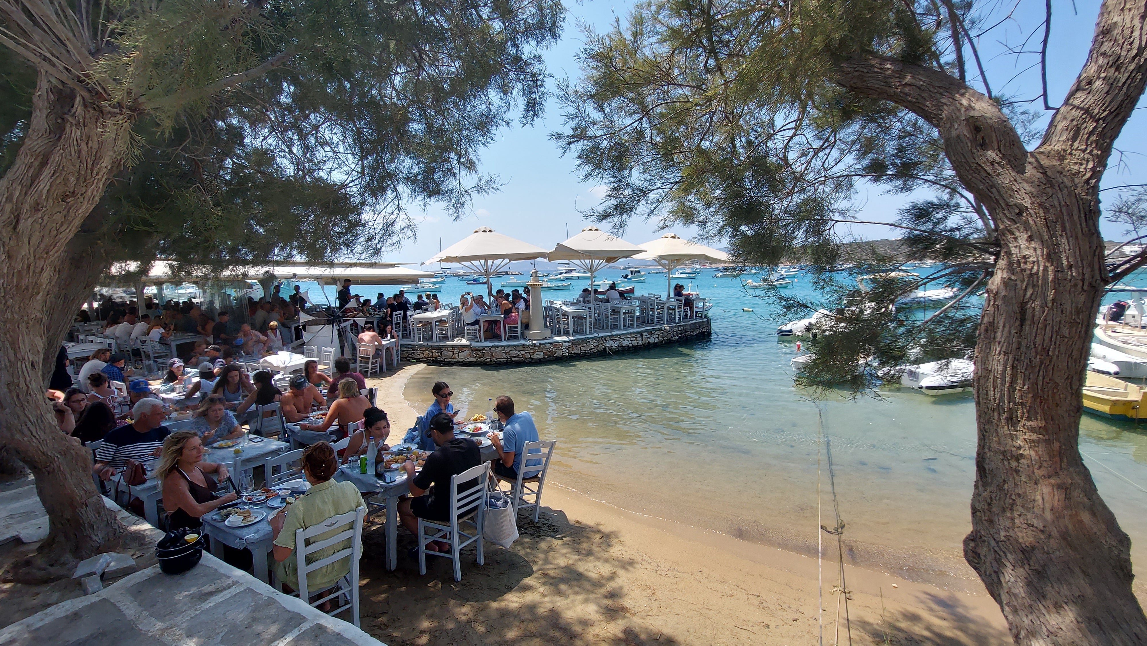 The quaint seaside village of Aliki, where there are taverna tables on the actual beach