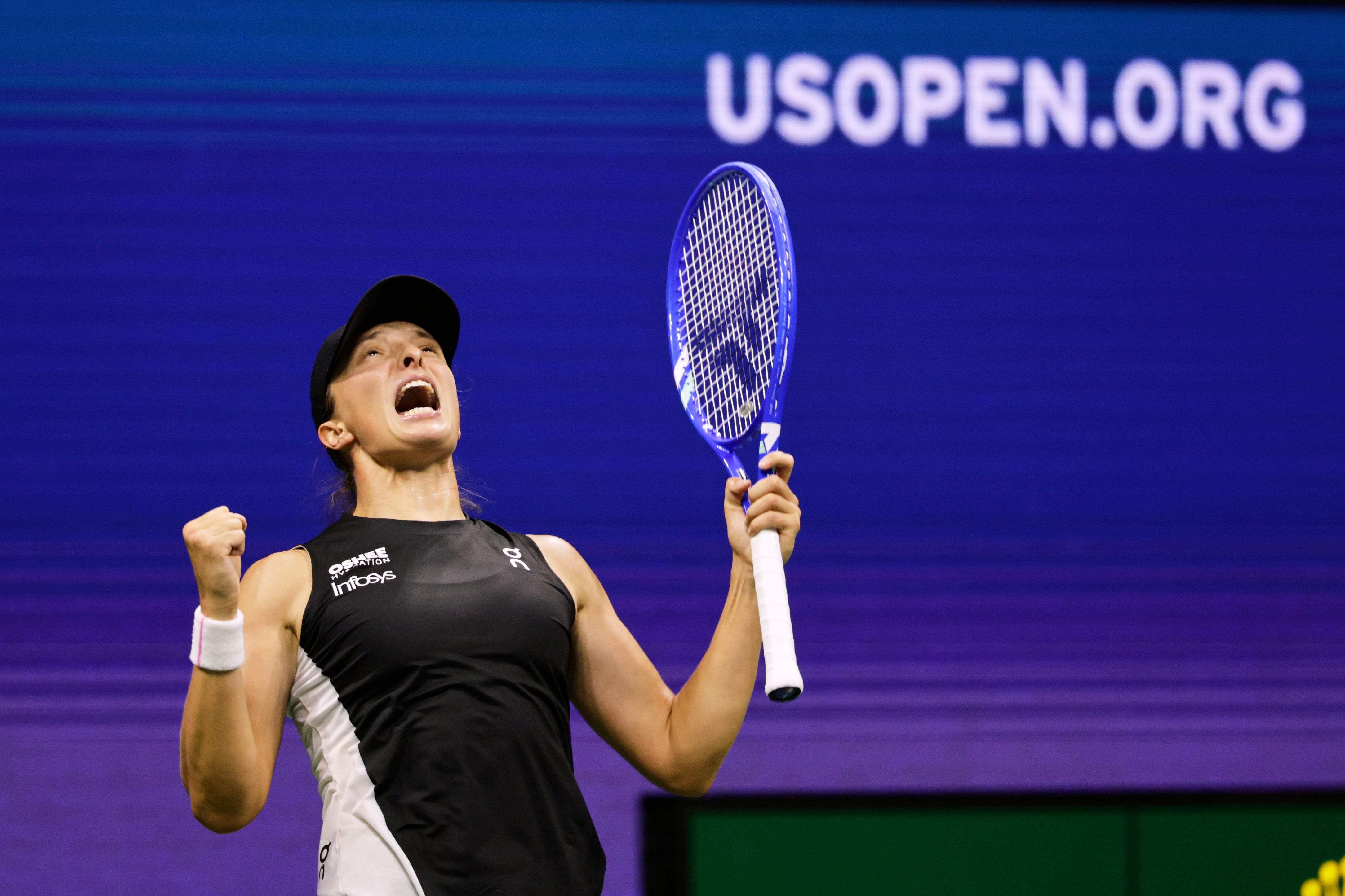 Iga Swiatek celebrates beating Anna Kalinskaya (Adam Hunger/AP)