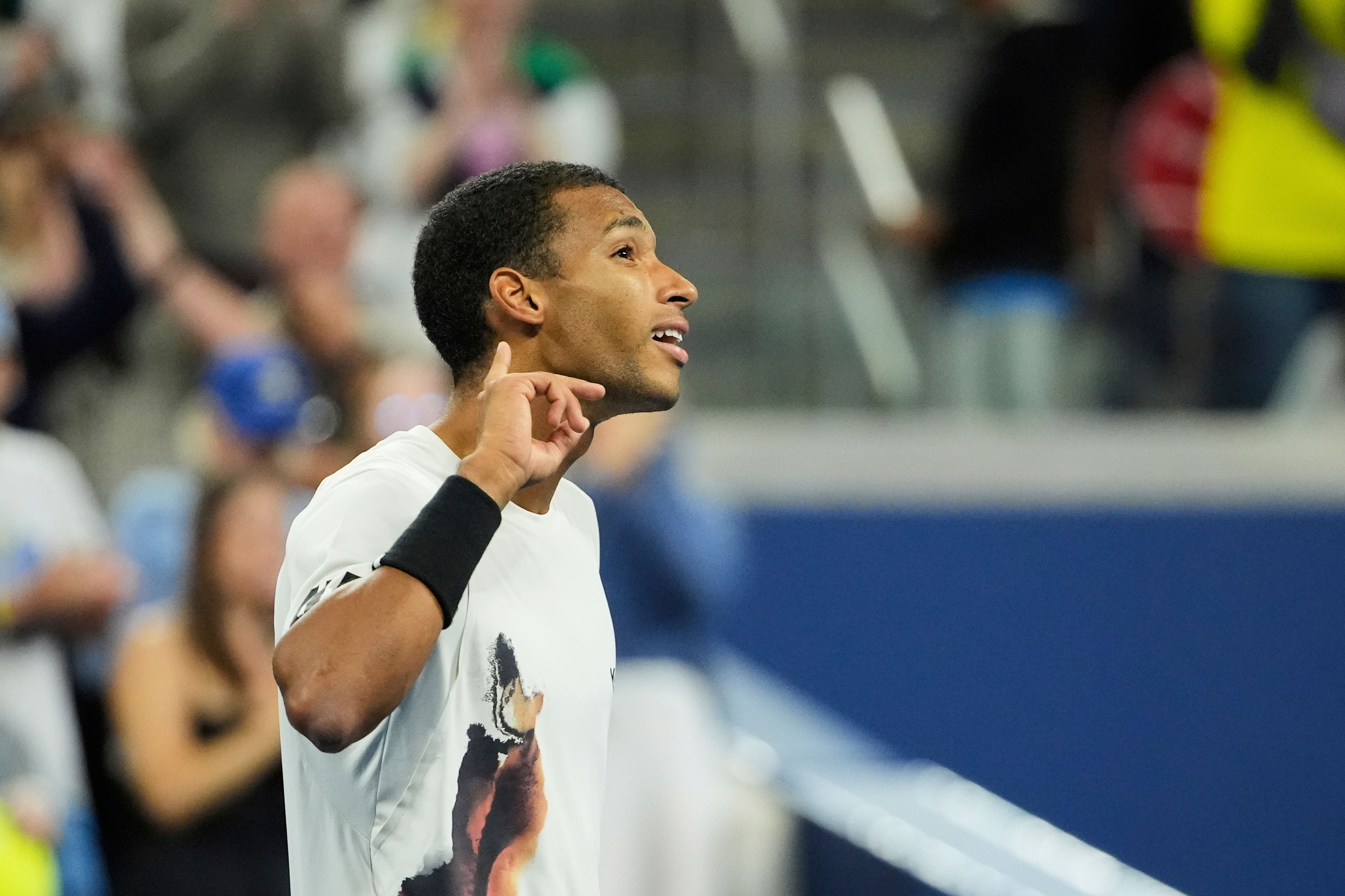 Felix Auger-Aliassime signals to the crowd after beating Zverev (Pamela Smith/AP)