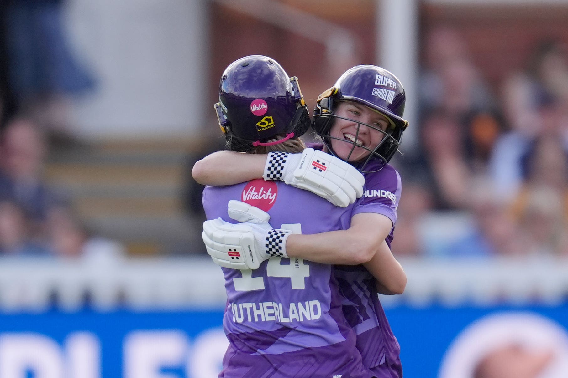 Nicola Carey, right, hugs Annabel Sutherland after Northern Superchargers’ maiden Hundred title (John Walton/PA)
