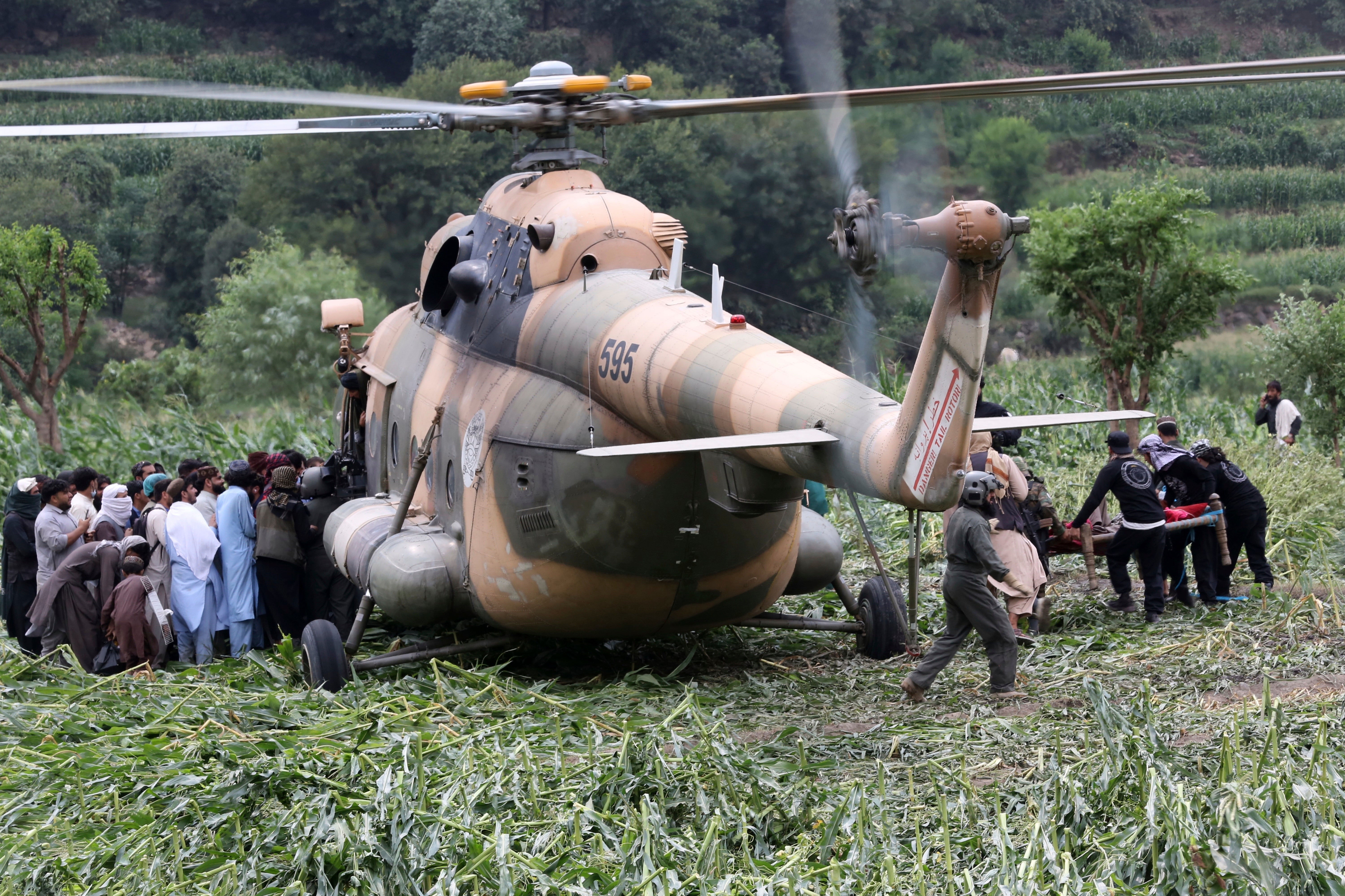 A military helicopter transport injured victims in Mazar Dara, Kunar province